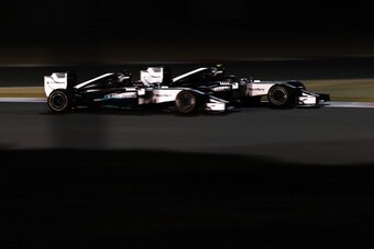 SAKHIR, BAHRAIN - APRIL 06:  Nico Rosberg (R) of Germany and Mercedes GP and team mate  Lewis Hamilton (L) of Great Britain and Mercedes GP battle for the lead during Bahrain Formula One Grand Prix at the Bahrain International Circuit on April 6, 2014 in 