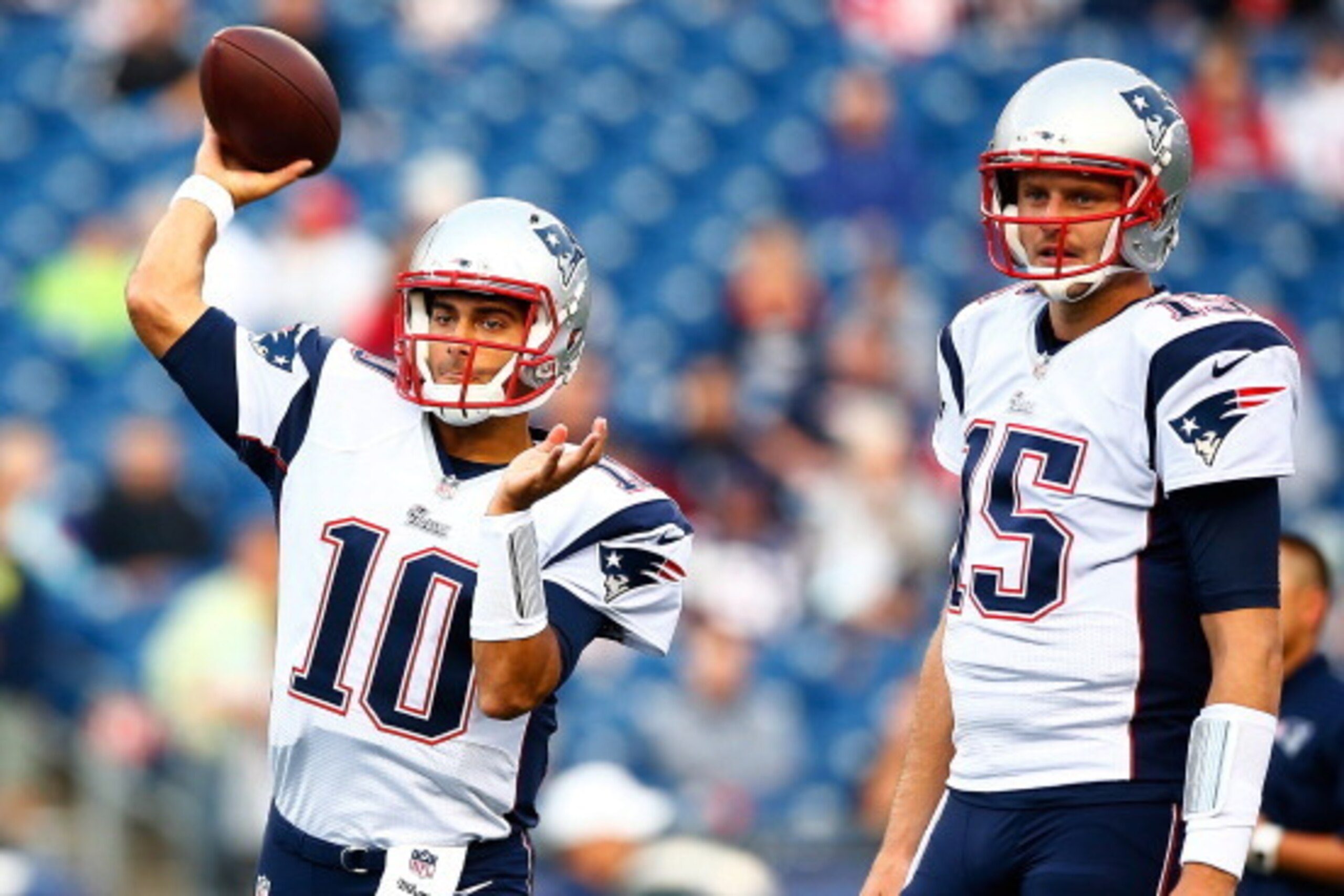 FOXBORO, MA - AUGUST 15: Jimmy Garoppolo #10 and Ryan Mallett #15 of the New England Patriots warm up prior to the preseason game against the Philadelphia Eagles at Gillette Stadium on August 15, 2014 in Foxboro, Massachusetts.  (Photo by Jared Wickerham/