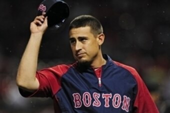 Aug 6, 2014; St. Louis, MO, USA; Boston Red Sox left fielder Allen Craig (5) salutes St. Louis Cardinals fans before a game at Busch Stadium. Mandatory Credit: Jeff Curry-USA TODAY Sports