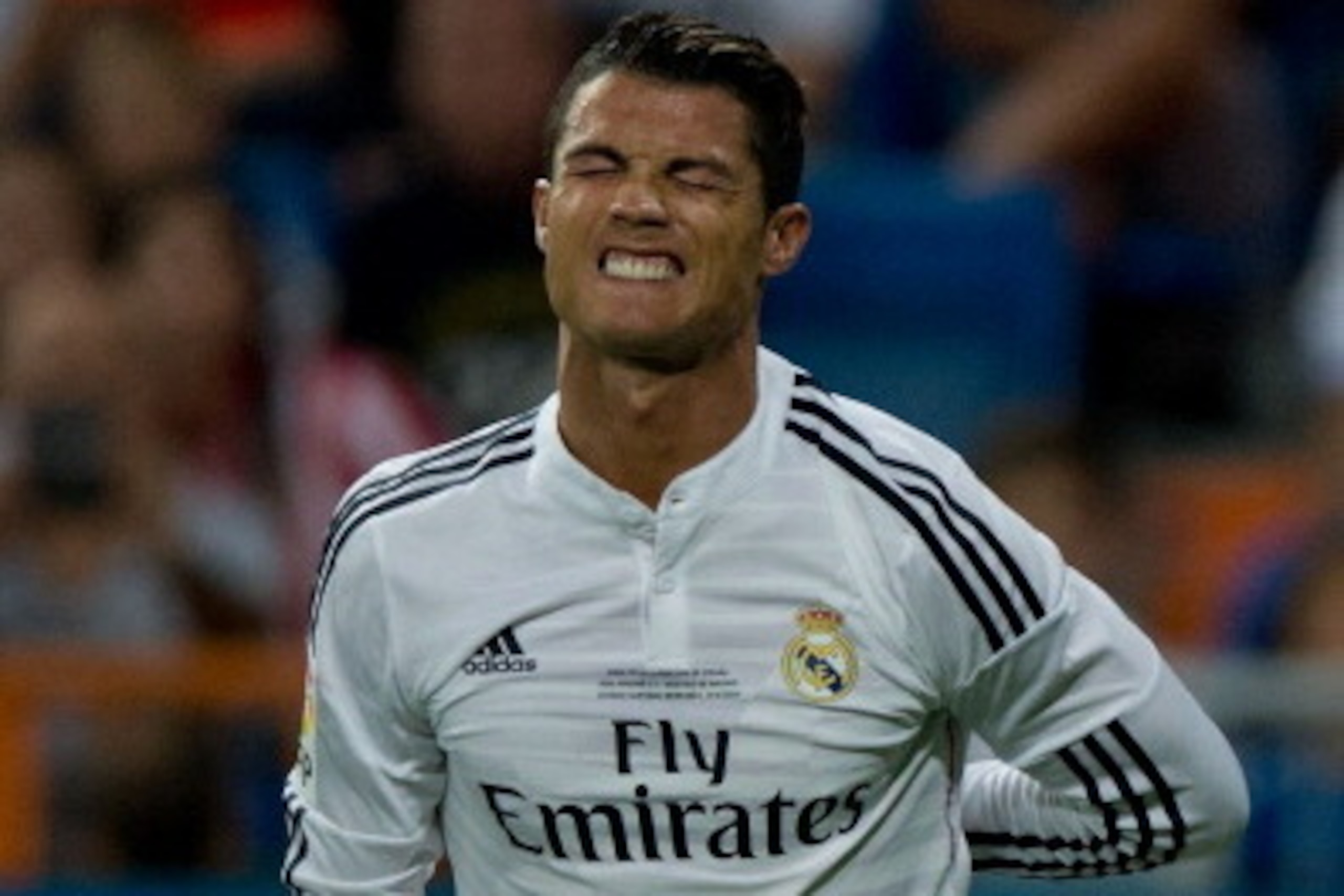MADRID, SPAIN - AUGUST 19: Cristiano Ronaldo of Real Madrid CF grimaces in pain during the Supercopa first leg match between Real Madrid and Club Atletico de Madrid at Estadio Santiago Bernabeu on August 19, 2014 in Madrid, Spain. (Photo by Gonzalo Arro MADRID, SPAIN - AUGUST 19: Cristiano Ronaldo of Real Madrid CF grimaces in pain during the Supercopa first leg match between Real Madrid and Club Atletico de Madrid at Estadio Santiago Bernabeu on August 19, 2014 in Madrid, Spain. (Photo by Gonzalo Arro