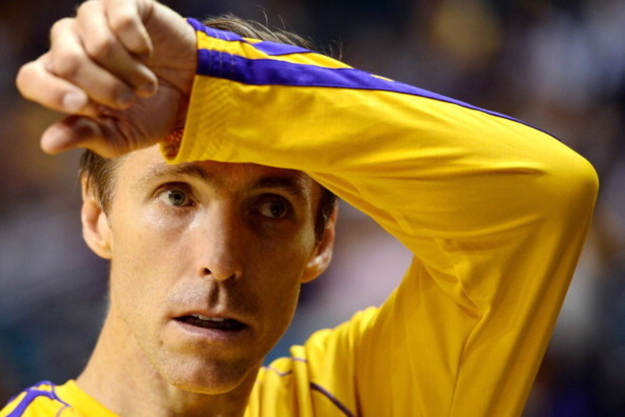 LAS VEGAS, NV - OCTOBER 10:  Steve Nash #10 of the Los Angeles Lakers wipes his brow during warmups before a preseason game against the Sacramento Kings at the MGM Grand Garden Arena on October 10, 2013 in Las Vegas, Nevada. Sacramento won 104-86. NOTE TO