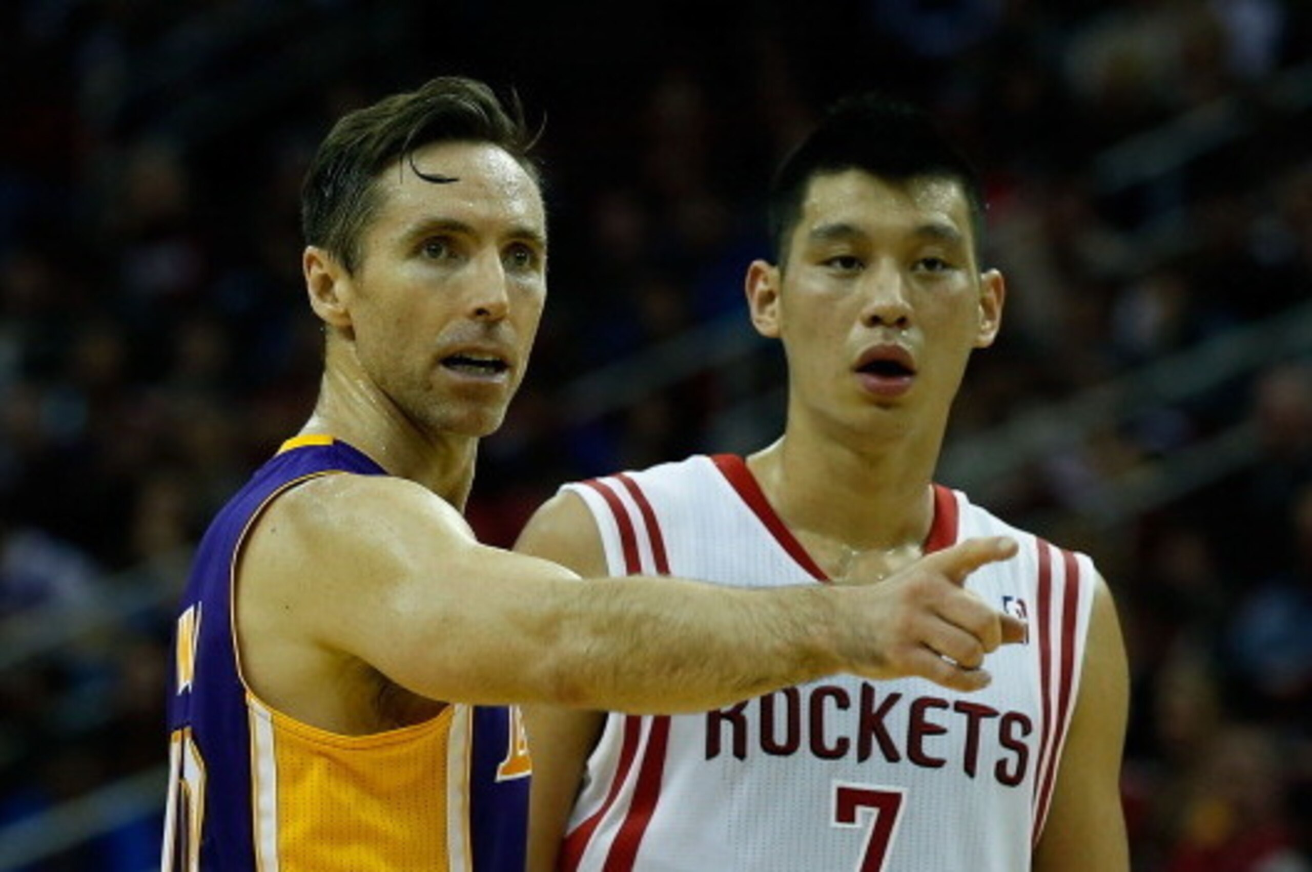 HOUSTON, TX - JANUARY 08:  Jeremy Lin #7 of the Houston Rockets and Steve Nash #10 of the Los Angeles Lakers wait for a play at Toyota Center on January 8, 2013 in Houston, Texas.  NOTE TO USER: User expressly acknowledges and agrees that, by downloading 