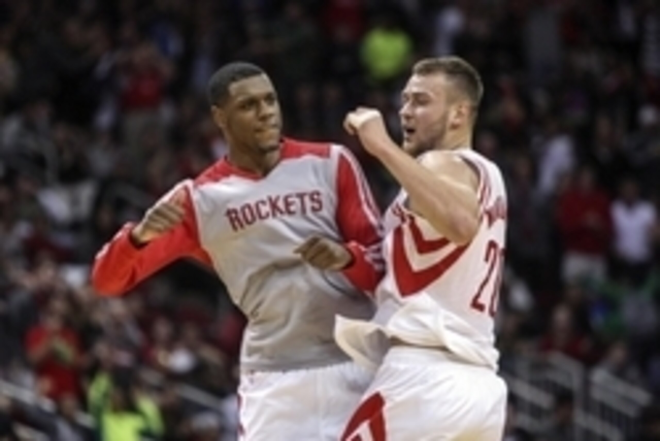 Dec 26, 2013; Houston, TX, USA; Houston Rockets power forward Donatas Motiejunas (20) is congratulated by power forward Terrence Jones (6) after scoring a basket during the fourth quarter against the Memphis Grizzlies at Toyota Center. Mandatory Credit: T