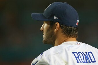 MIAMI GARDENS, FL - AUGUST 23:  Tony Romo #9 of the Dallas Cowboys watches from the sidelines in the third quarter of play against the Miami Dolphins during a preseason game at Sun Life Stadium on August 23, 2014 in Miami Gardens, Florida.  (Photo by Mike