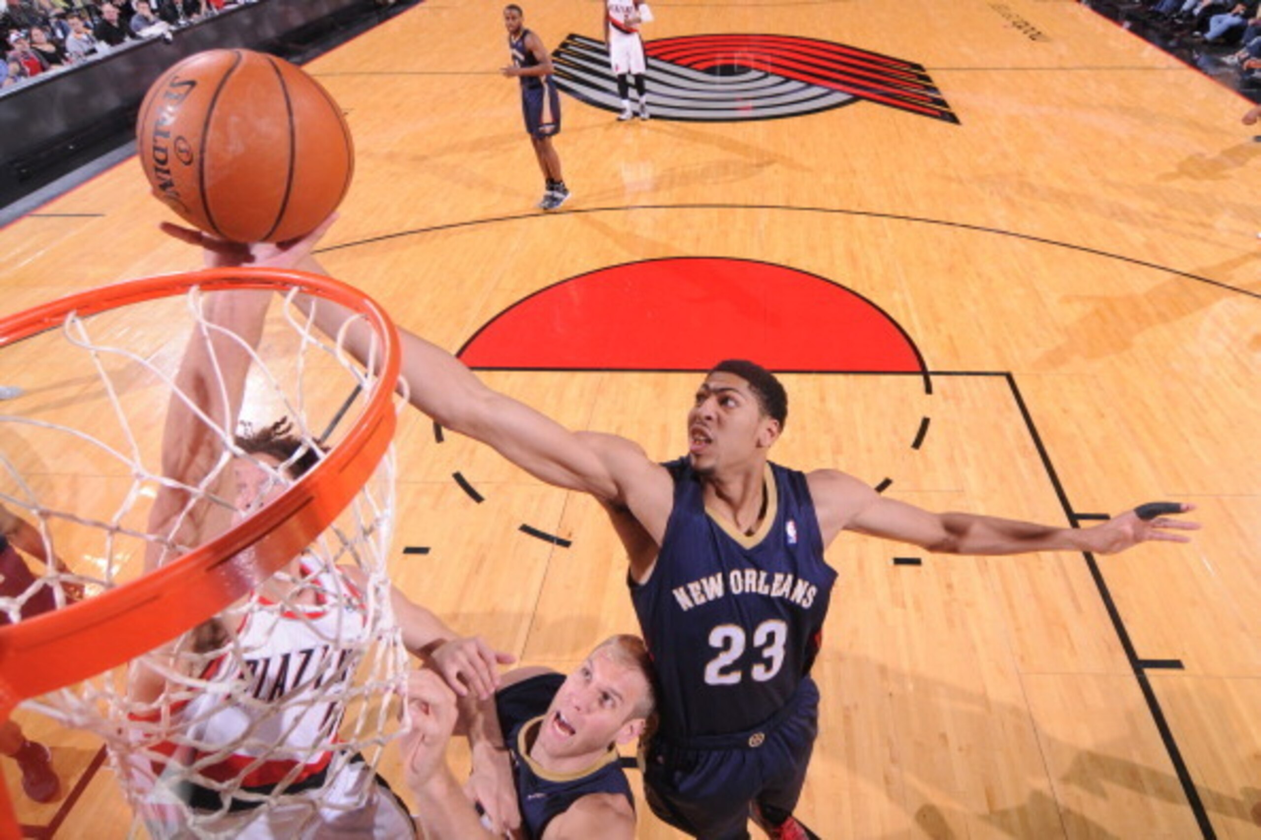 PORTLAND, OR - APRIL 6:  Anthony Davis #23 of the New Orleans Pelicans grabs a rebound against the Portland Trail Blazers on April 6, 2014 at the Moda Center Arena in Portland, Oregon. NOTE TO USER: User expressly acknowledges and agrees that, by download