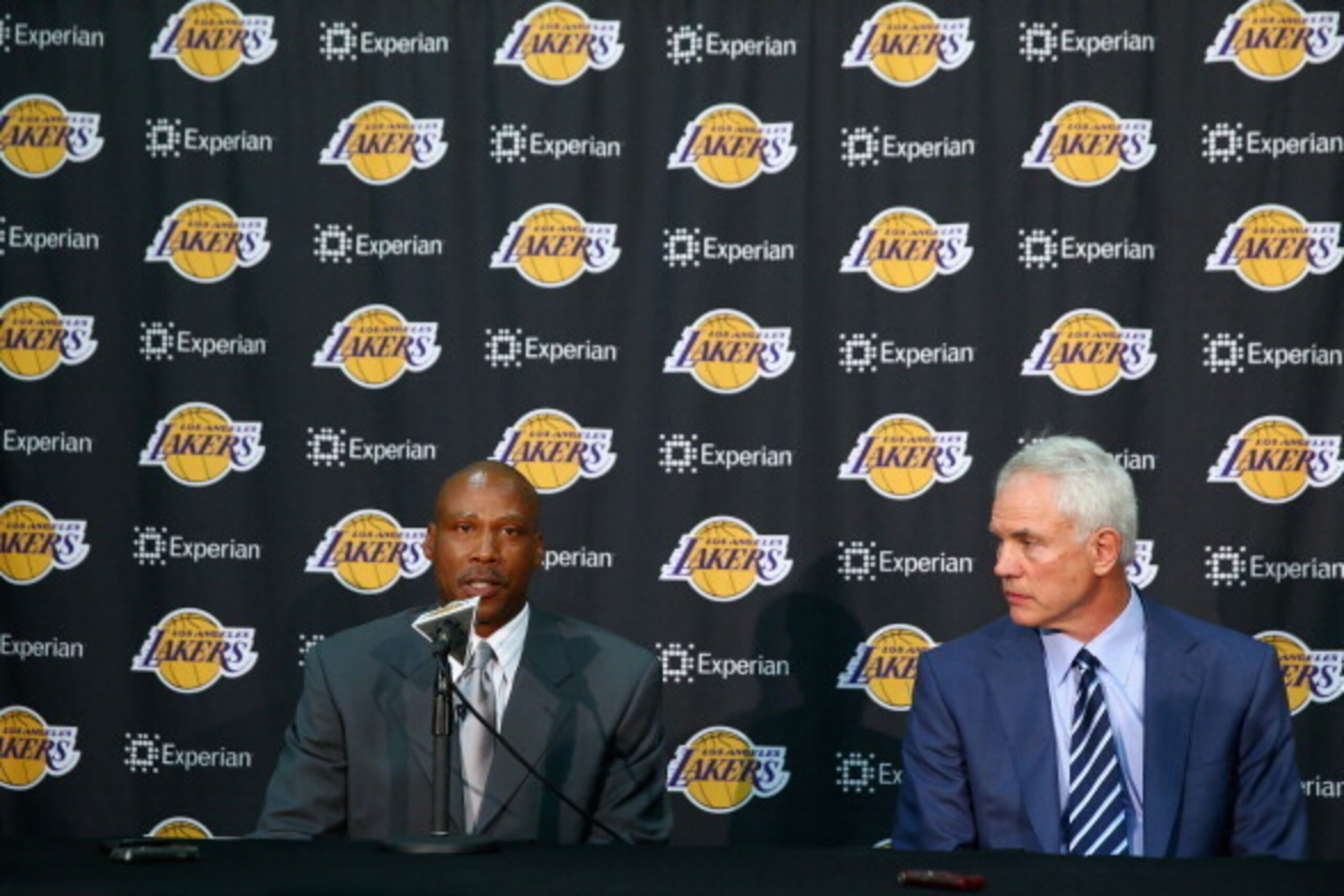 EL SEGUNDO, CA - JULY 29:  Byron Scott addresses the media, as Los Angeles Lakers general manager Mitch Kupchak looks on during a press conference to introduce Byron Scott as the new head coach of the Los Angeles Lakers at Toyota Sports Center on July 29,