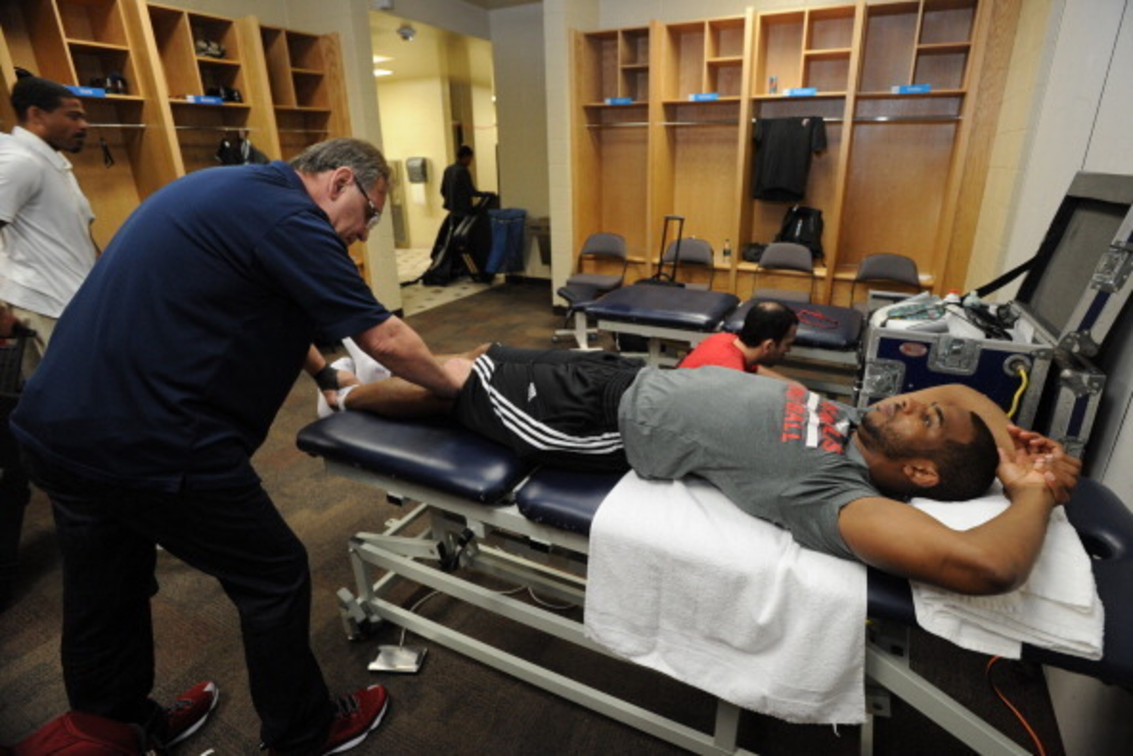 OKLAHOMA CITY, OK - MAY 13: Chris Paul #3 of the Los Angeles Clippers is worked on in the locker room before Game Five of the Western Conference Semifinals against the Oklahoma City Thunder during the 2014 NBA Playoffs on May 13, 2014 at the Chesapeake E OKLAHOMA CITY, OK - MAY 13: Chris Paul #3 of the Los Angeles Clippers is worked on in the locker room before Game Five of the Western Conference Semifinals against the Oklahoma City Thunder during the 2014 NBA Playoffs on May 13, 2014 at the Chesapeake E