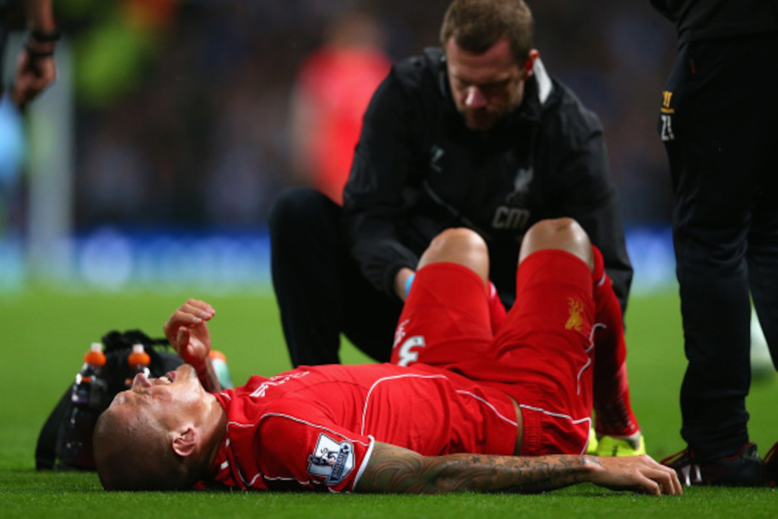 MANCHESTER, ENGLAND - AUGUST 25:   Martin Skrtel of Liverpool receives treatment during the Barclays Premier League match between Manchester City and Liverpool at the Etihad Stadium on August 25, 2014 in Manchester, England.  (Photo by Clive Brunskill/Get