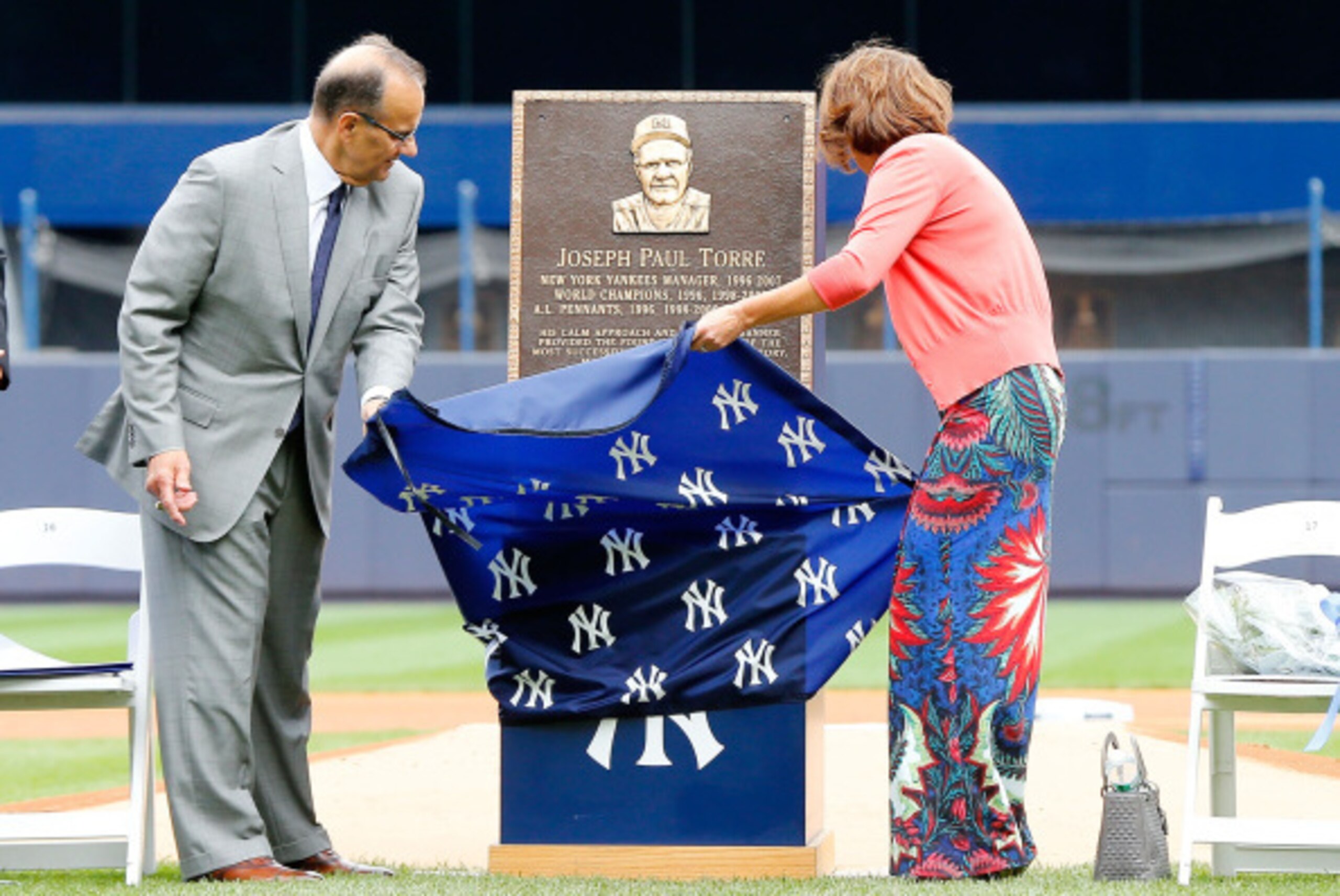 NEW YORK, NY - AUGUST 23:  Former New York Yankees manager Joe Torre unviels his plaque that will be installed in Monument Park with his wife Ali at Yankee Stadium during a ceremony prior to a game against the Chicago White Sox on August 23, 2014 in the B