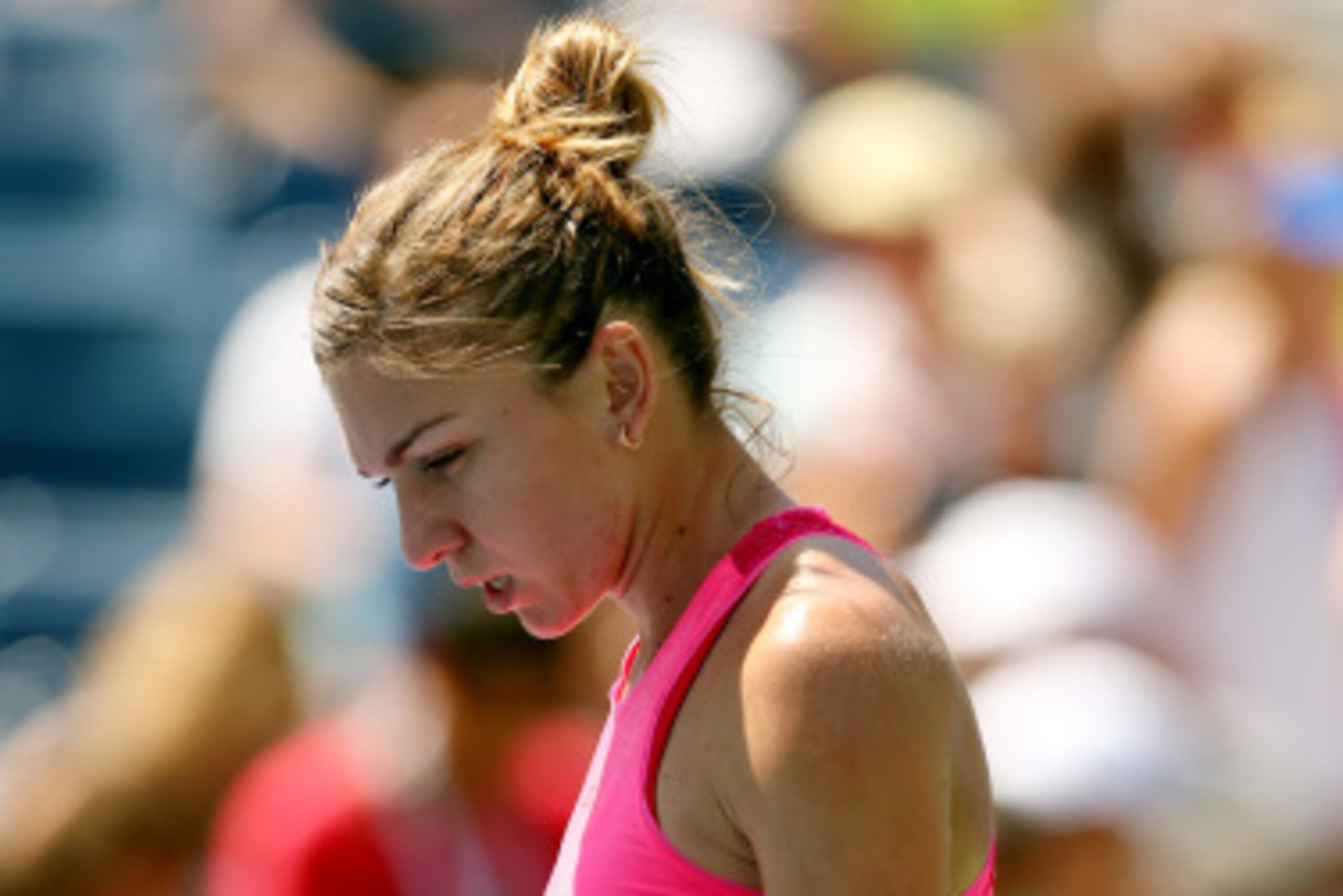 NEW YORK, NY - AUGUST 25:  Simona Halep of Romania reacts against Danielle Rose Collins of the United States during their women's singles first round match on Day One of the 2014 US Open at the USTA Billie Jean King National Tennis Center on August 25, 20