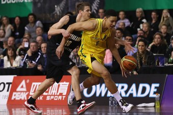 AUCKLAND, NEW ZEALAND - AUGUST 14: Tom Abercrombie of New Zealand (L) and Ben Simmons of Australia in action during the Men's FIBA Oceania Championship match between the New Zealand Tall Blacks and the Australian Boomers at North Shore Events Centre on Au