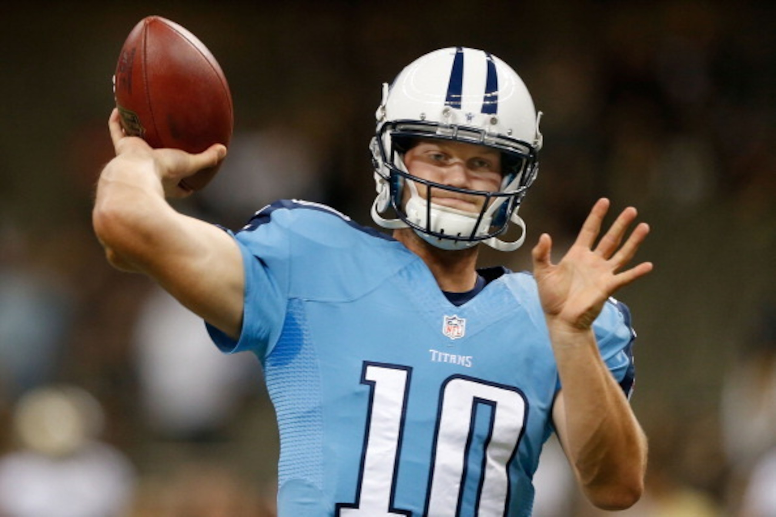 NEW ORLEANS, LA - AUGUST 15:  Jake Locker #10 of the Tennessee Titans warms up on field before the start of the first preseason game between the New Orleans Saints and the Tennessee Titans at Mercedes-Benz Superdome on August 15, 2014 in New Orleans, Loui