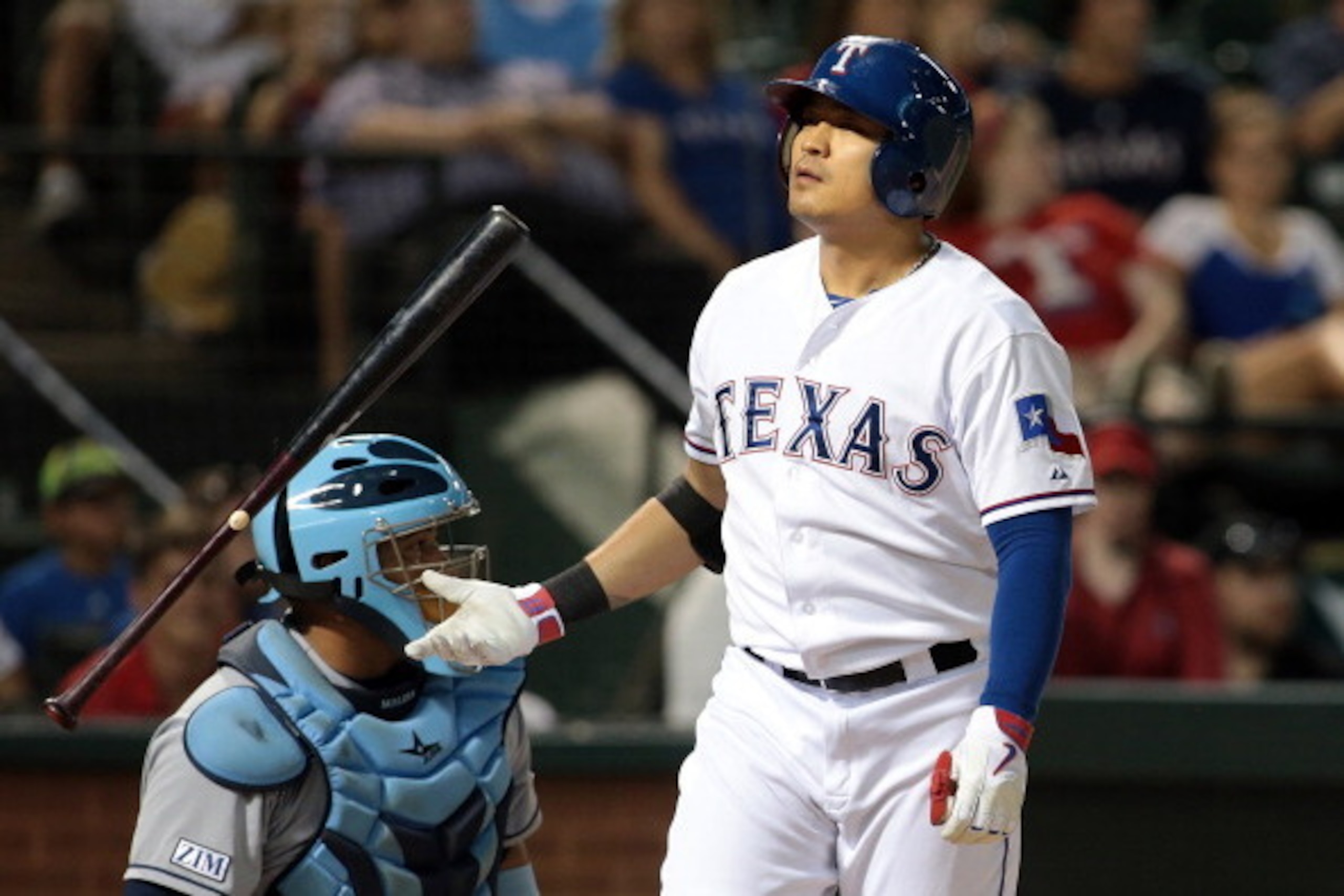 ARLINGTON, TX - AUGUST 14: Shin-Soo Choo #17 of the Texas Rangers flips his bat after striking out in the eighth inning against the Tampa Bay Rays at Globe Life Park in Arlington on August 14, 2014 in Arlington, Texas.  (Photo by Rick Yeatts/Getty Images)