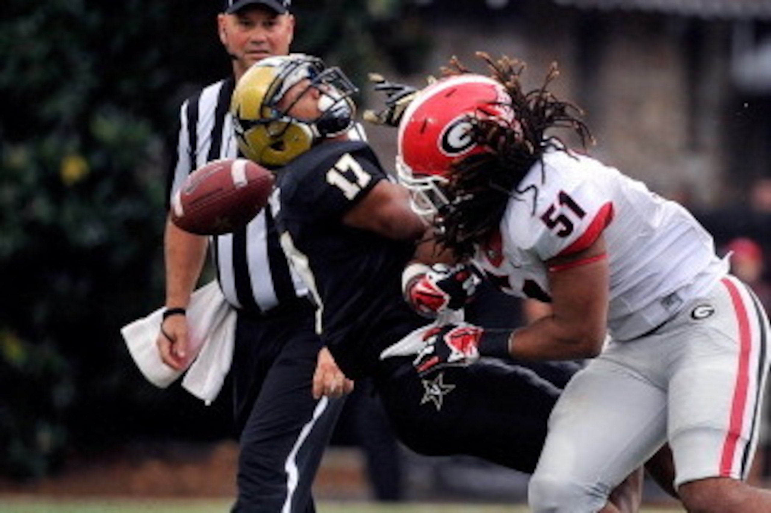 NASHVILLE, TN - OCTOBER 19:  Line backer Ramik Wilson #51 of the Georgia Bulldogs hits wide receiver Jonathan Krause #17 causing an incomplete pass and drawing a flag for a personal foul at Vanderbilt Stadium on October 19, 2013 in Nashville, Tennessee.  