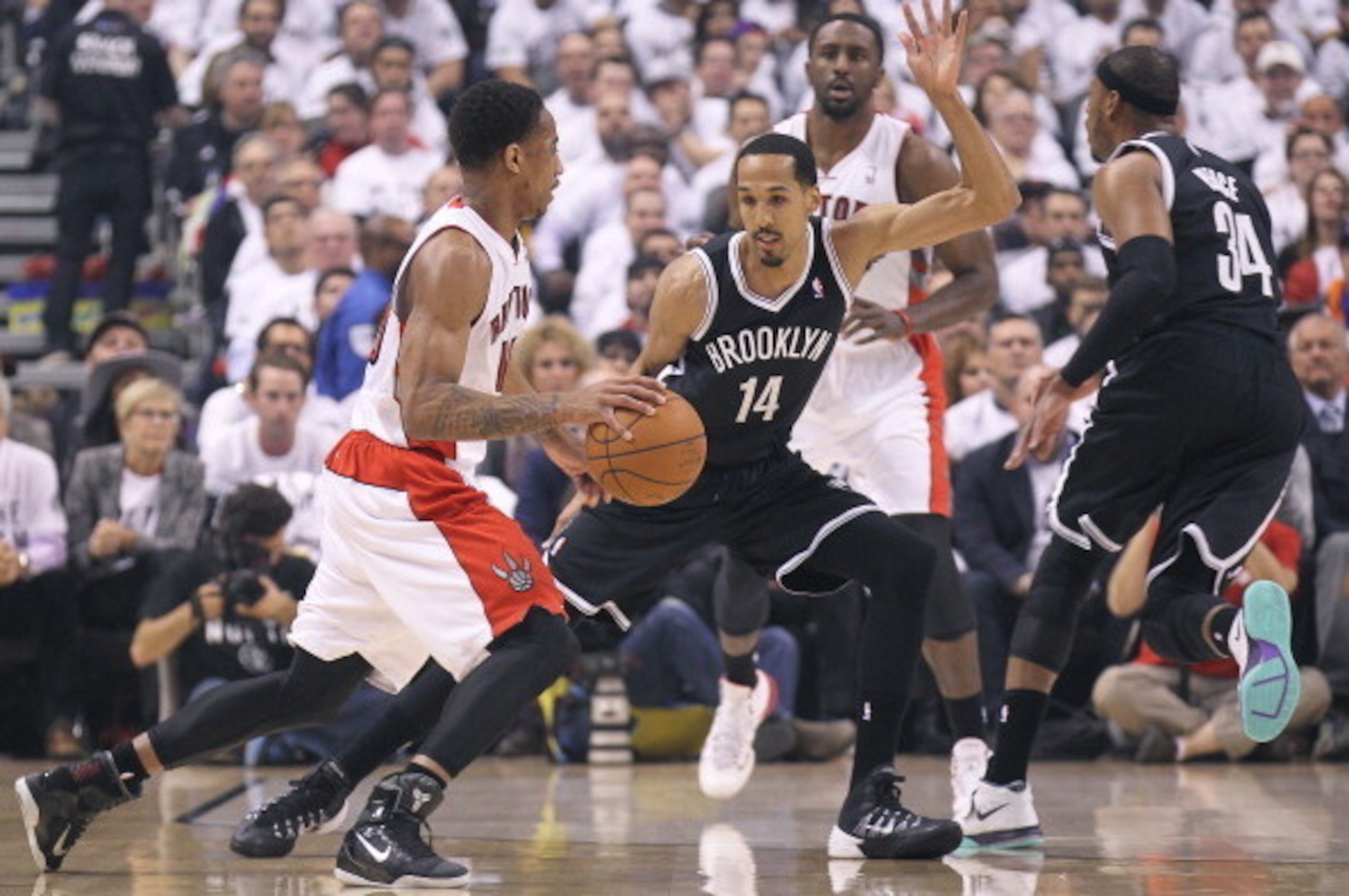 TORONTO, ON - APRIL 30:  Shaun Livingston #14 of the Brooklyn Nets defends against DeMar DeRozan #10 of the Toronto Raptors in Game Five of the NBA Eastern Conference Quarterfinals at the Air Canada Centre on April 30, 2014 in Toronto, Ontario, Canada. Th