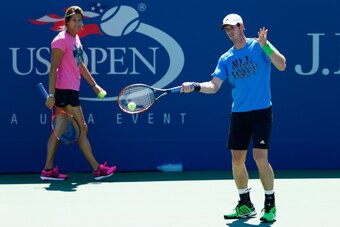 NEW YORK, NY - AUGUST 24:  Andy Murray of Great Britain in a practice session watched by coach Amelie Mauresmo during previews for the US Open tennis at USTA Billie Jean King National Tennis Center on August 24, 2014 in New York City.  (Photo by Julian Fi