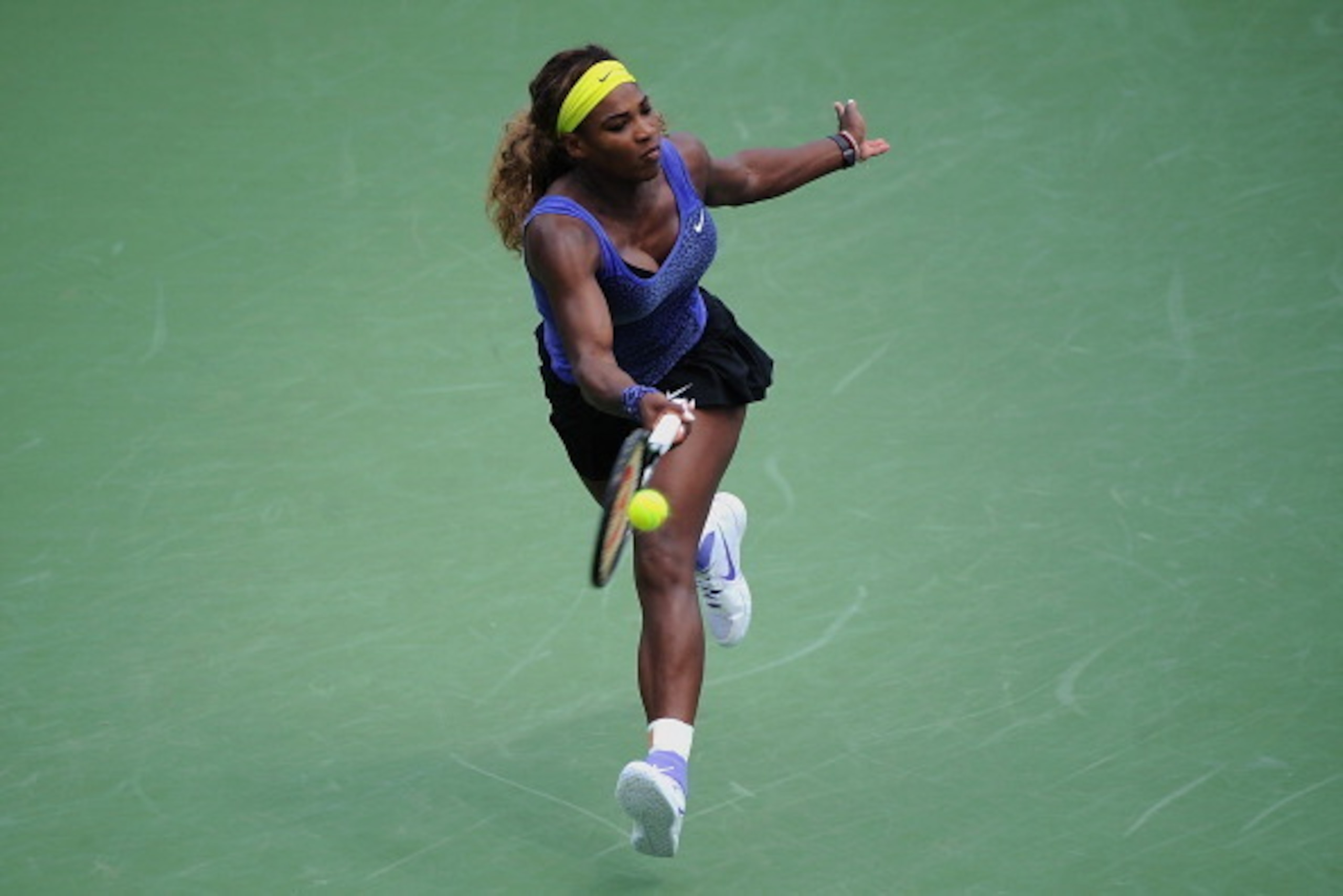 CINCINNATI, OH - AUGUST 17:  Serena Williams reaches for the ball during a final match Ana Ivanovic of Serbia on day 9 of the Western & Southern Open at the Linder Family Tennis Center on August 17, 2014 in Cincinnati, Ohio.  (Photo by Jonathan Moore/Gett