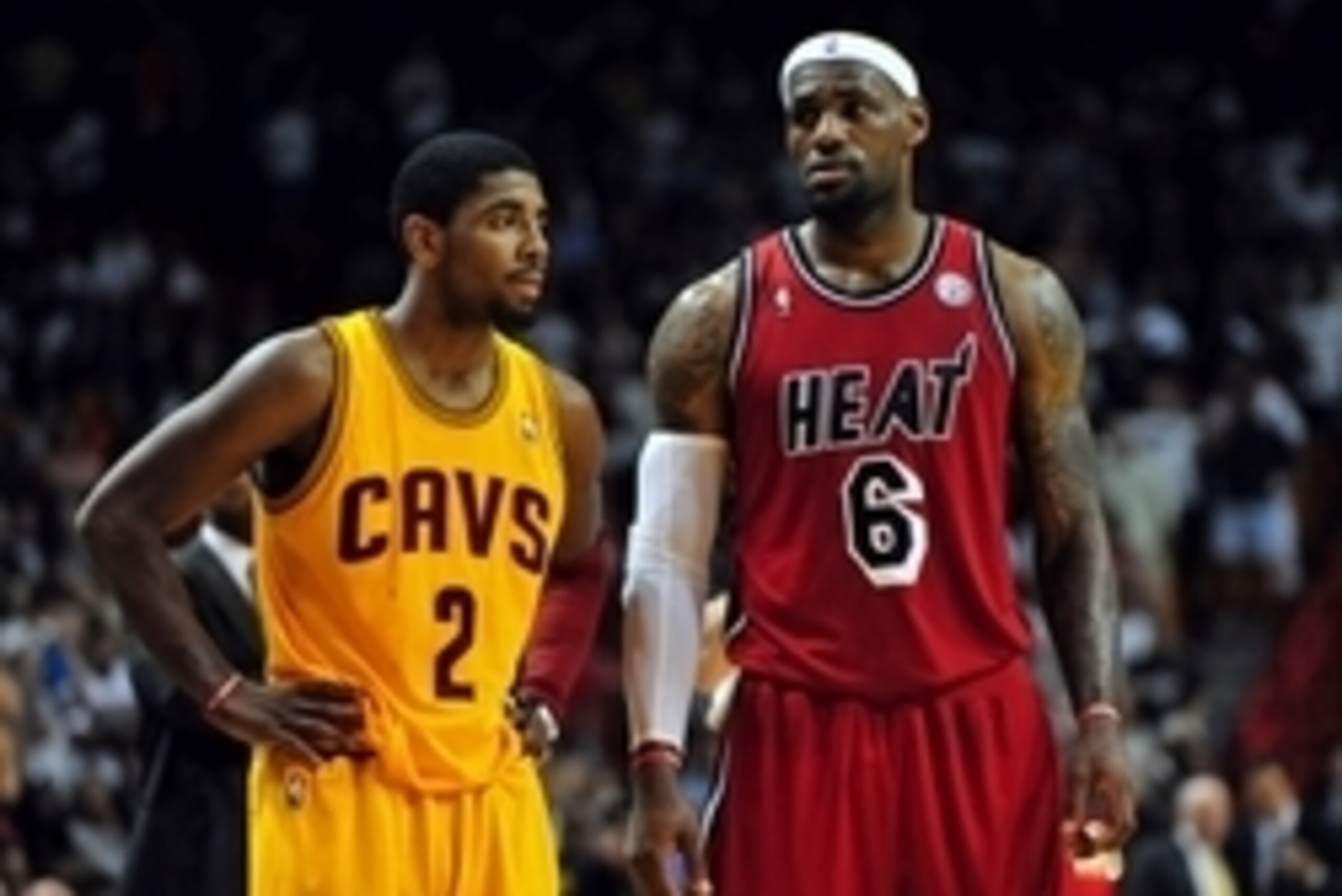 Feb 24, 2013; Miami, FL, USA; Cleveland Cavaliers point guard Kyrie Irving (2) and Miami Heat small forward LeBron James (6) during the second half at the American Airlines Arena.  MIami won 109-105. Mandatory Credit: Steve Mitchell-USA TODAY Sports
