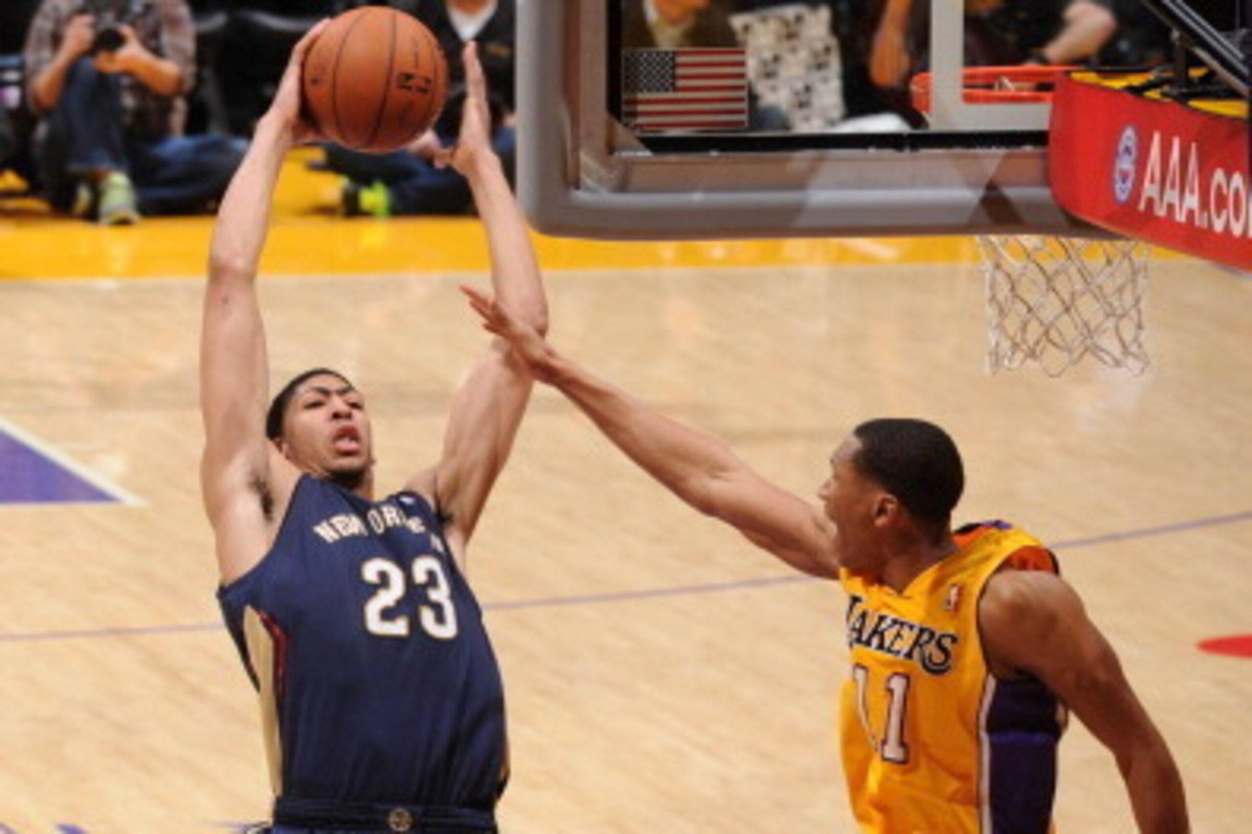 LOS ANGELES, CA - MARCH 4: Anthony Davis #23 of the New Orleans Pelicans pulls down a rebound against Wesley Johnson #11 of the Los Angeles Lakers at Staples Center on March 4, 2014 in Los Angeles, California. NOTE TO USER: User expressly acknowledges and