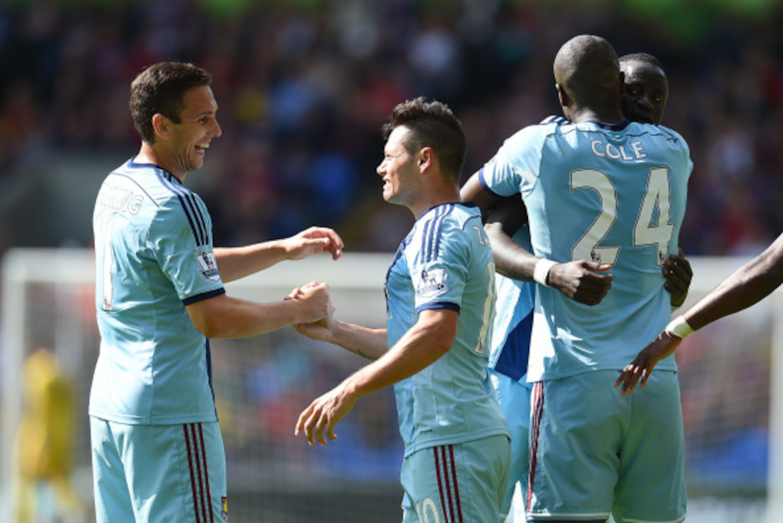 LONDON, ENGLAND - AUGUST 23: Goalscorer Mauro Zarate (R) of West Ham United celebrates with Stewart Downing (L) during the Premiere League match between Crystal Palace and West Ham United at Selhurst Park on August 23, 2014 in London, England.  (Photo by 