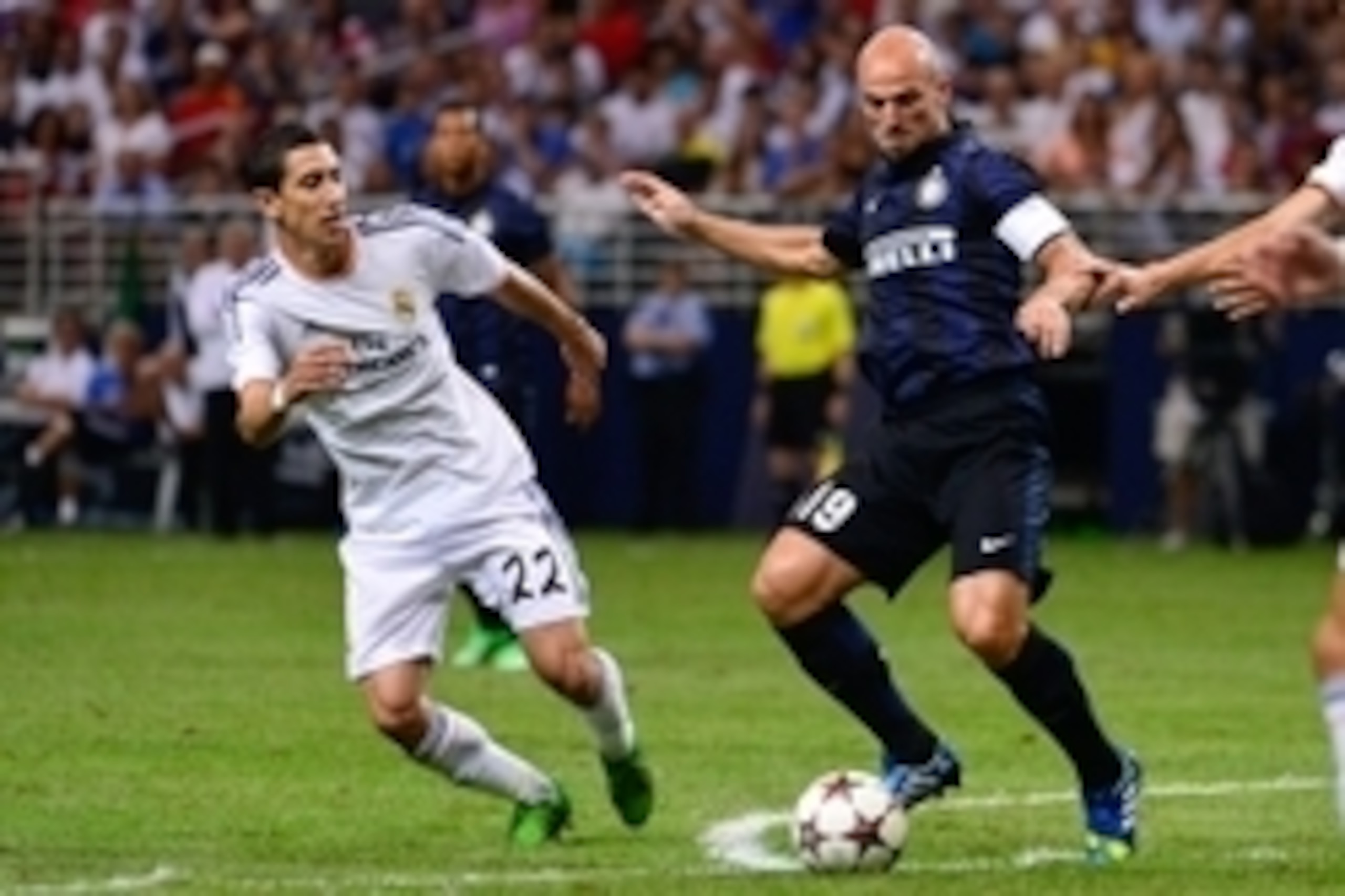 Aug 10, 2013; St. Louis, MO, USA; Inter Milan midfielder Esteban Cambiasso (19) controls the ball away from Real Madrid midfielder Angel Di Maria (22). Mandatory Credit: Scott Rovak-USA TODAY Sports Aug 10, 2013; St. Louis, MO, USA; Inter Milan midfielder Esteban Cambiasso (19) controls the ball away from Real Madrid midfielder Angel Di Maria (22). Mandatory Credit: Scott Rovak-USA TODAY Sports