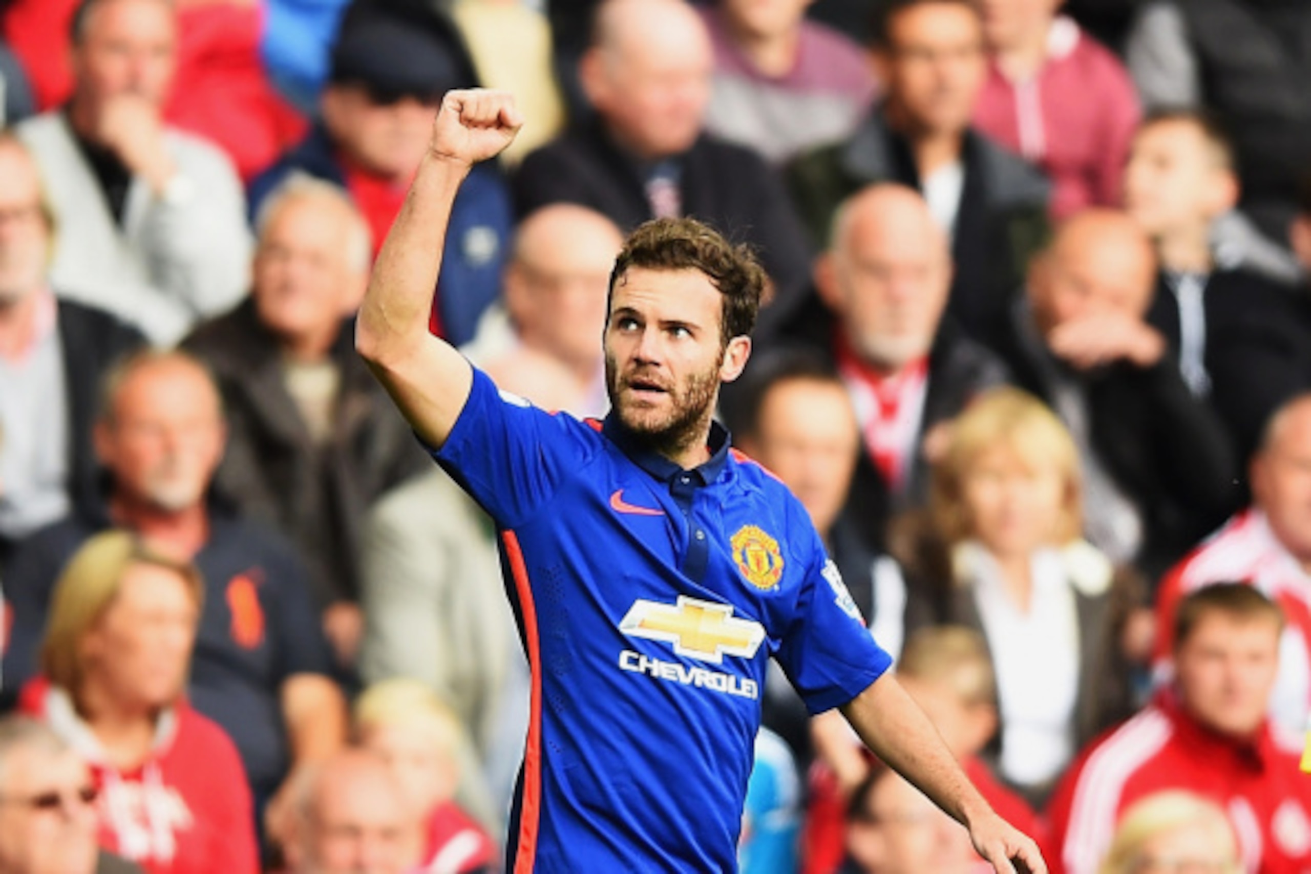SUNDERLAND, ENGLAND - AUGUST 24: Juan Mata of Manchester United celebrates scoring the opening goal during the Barclays Premier League match between Sunderland and Manchester United at Stadium of Light on August 24, 2014 in Sunderland, England.  (Photo by