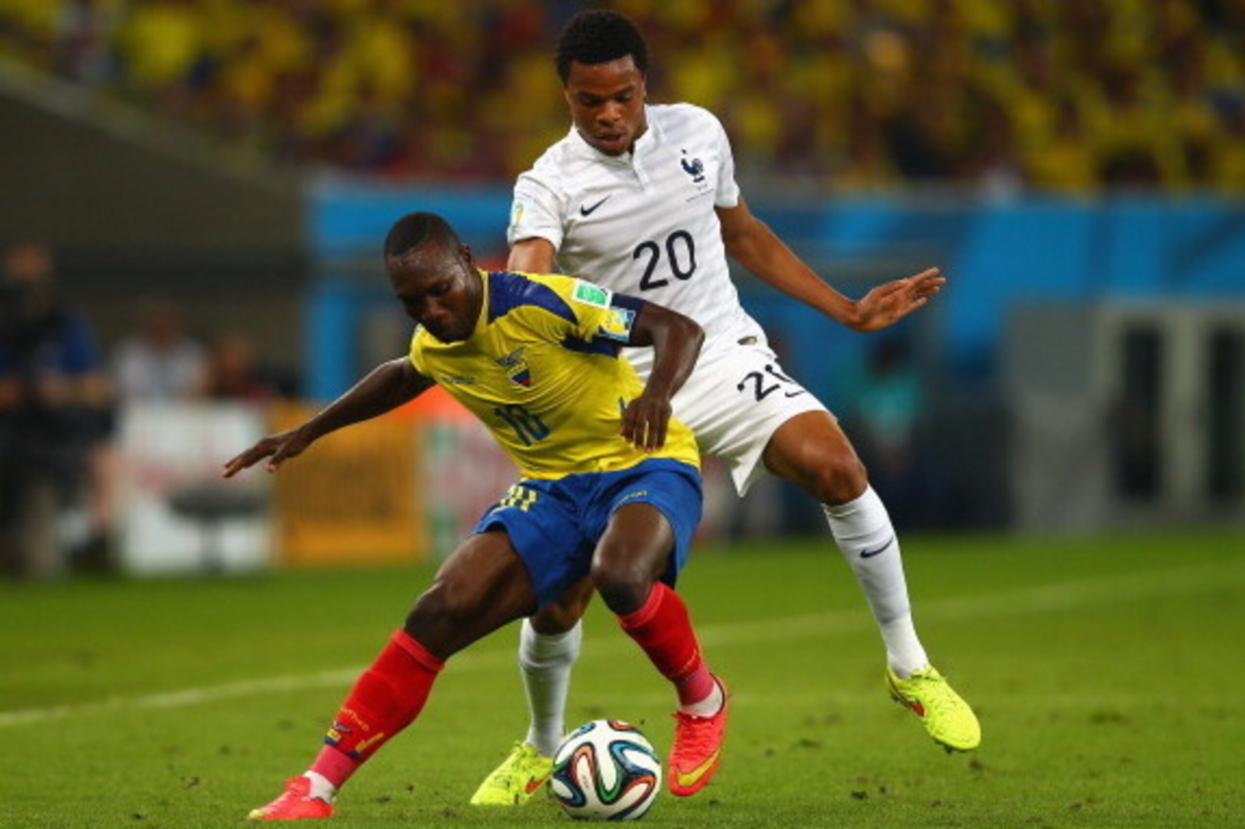 RIO DE JANEIRO, BRAZIL - JUNE 25: Oscar Bagui of Ecuador controls the ball against Loic Remy of France during the 2014 FIFA World Cup Brazil Group E match between Ecuador and France at Maracana on June 25, 2014 in Rio de Janeiro, Brazil.  (Photo by Clive