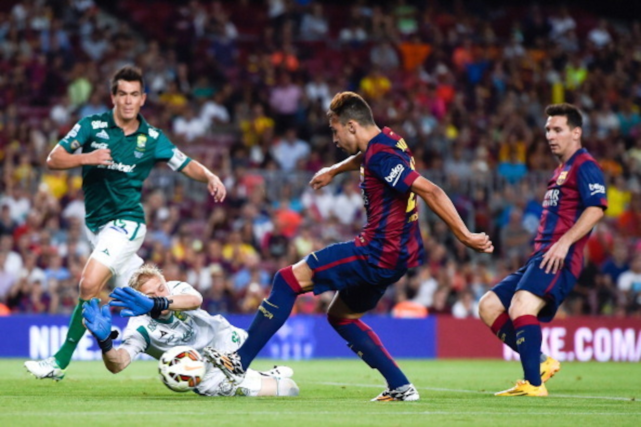 BARCELONA, SPAIN - AUGUST 18:  Munir of FC Barcelona scores his team's fourth goal during the Joan Gamper Trophy match between FC Barcelona and Club Leon at Camp Nou on August 18, 2014 in Barcelona, Spain.  (Photo by David Ramos/Getty Images)