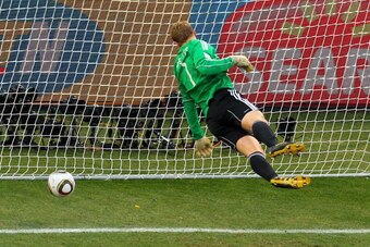 BLOEMFONTEIN, SOUTH AFRICA - JUNE 27:  Manuel Neuer of Germany watches the ball bounce over the line from a shot that hit the crossbar from Frank Lampard of England, but referee Jorge Larrionda judges the ball did not cross the line during the 2010 FIFA W