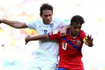 BELO HORIZONTE, BRAZIL - JUNE 24:  Bryan Ruiz of Costa Rica holds off a challenge by Frank Lampard of England during the 2014 FIFA World Cup Brazil Group D match between Costa Rica and England at Estadio Mineirao on June 24, 2014 in Belo Horizonte, Brazil