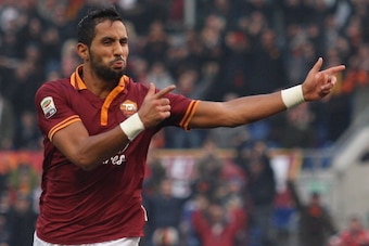 ROME, ITALY - DECEMBER 22:  Mehdi Benatia of AS Roma celebrates after scoring the third team's goal during the Serie A match between AS Roma and Calcio Catania at Stadio Olimpico on December 22, 2013 in Rome, Italy.  (Photo by Paolo Bruno/Getty Images)