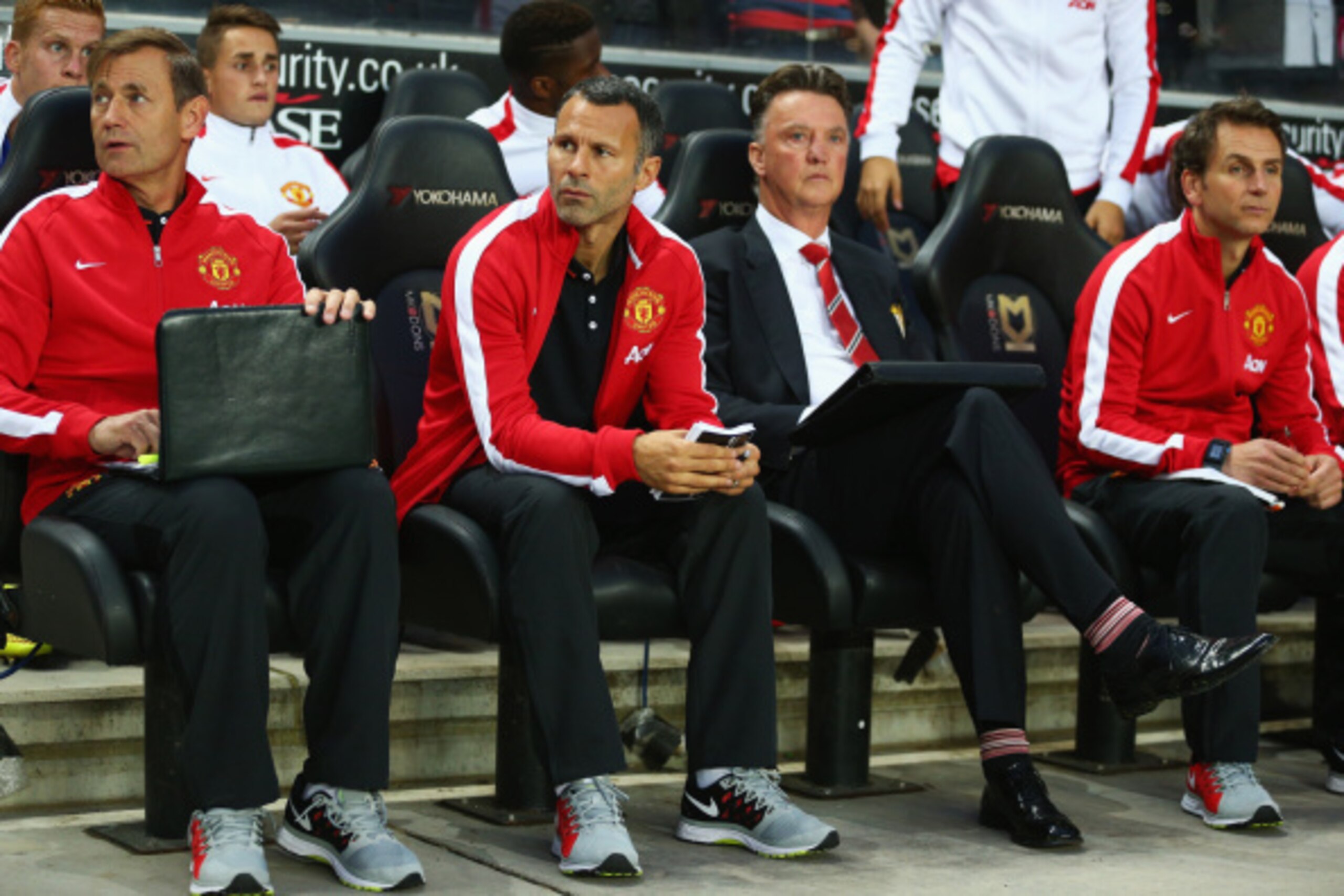 MILTON KEYNES, ENGLAND - AUGUST 26:  Assistant manager Ryan Giggs looks on with manager Louis van Gaal of Manchester United prior to the Capital One Cup Second Round match between MK Dons and Manchester United at Stadium mk on August 26, 2014 in Milton Ke