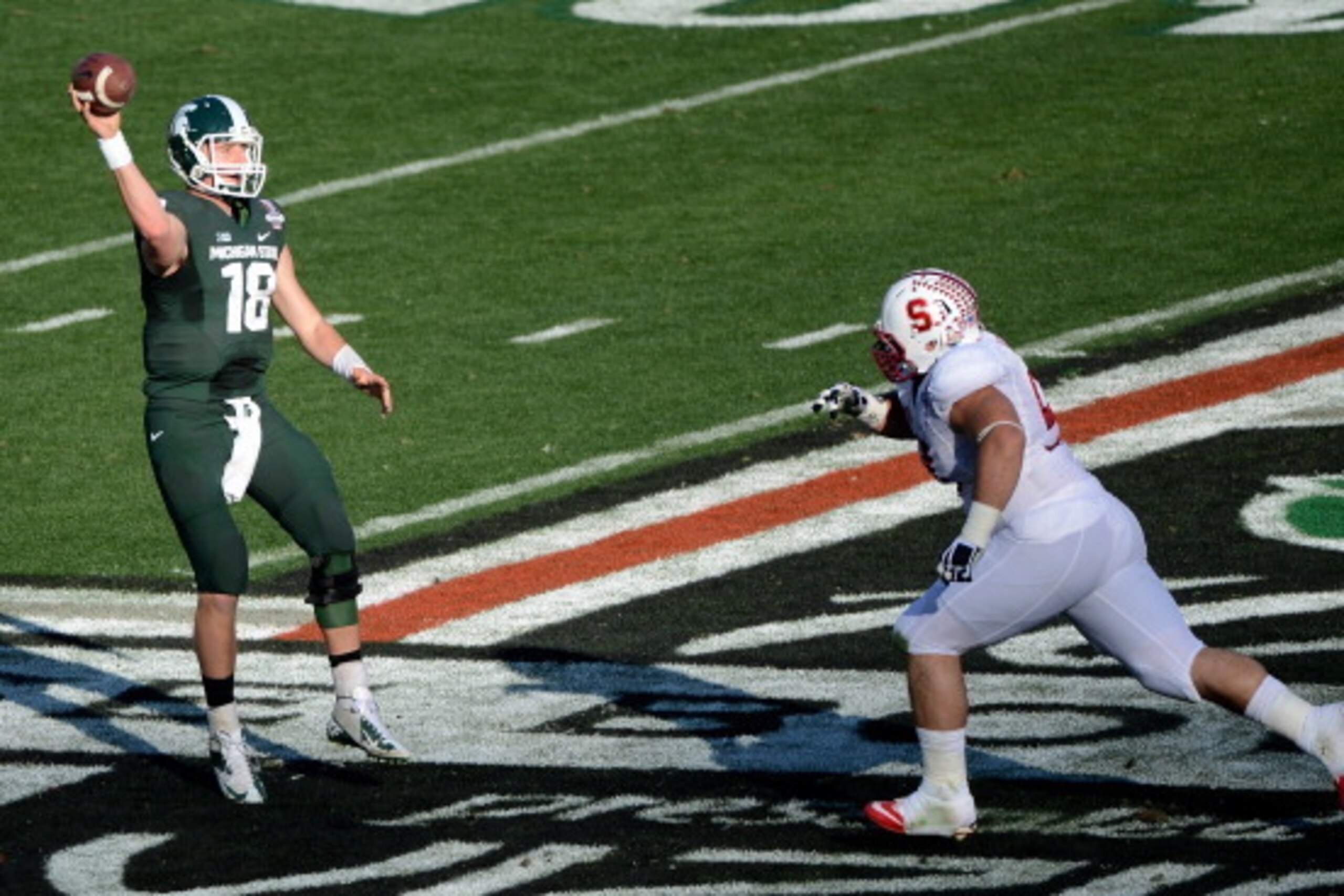 PASADENA, CA - JANUARY 01:  Quarterback Connor Cook #18 of the Michigan State Spartans throws the ball against the Stanford Cardinal during the 100th Rose Bowl Game presented by Vizio at the Rose Bowl on January 1, 2014 in Pasadena, California.  (Photo by