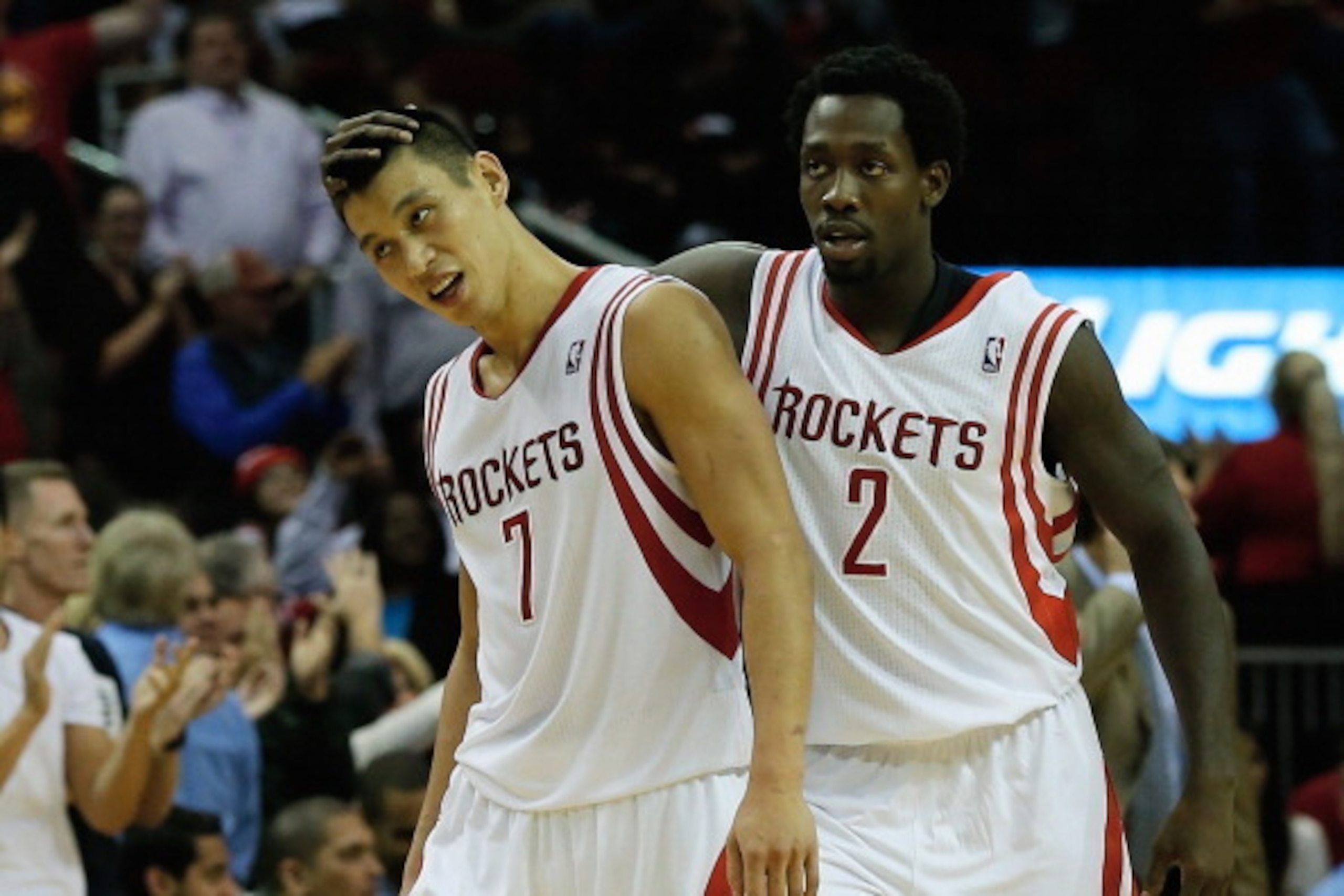 HOUSTON, TX - NOVEMBER 11:  Jeremy Lin #7 and Patrick Beverley #2 of the Houston Rockets celebrate as time winds down in the second overtime period during the game against the Toronto Raptors at Toyota Center on November 11, 2013 in Houston, Texas. NOTE T