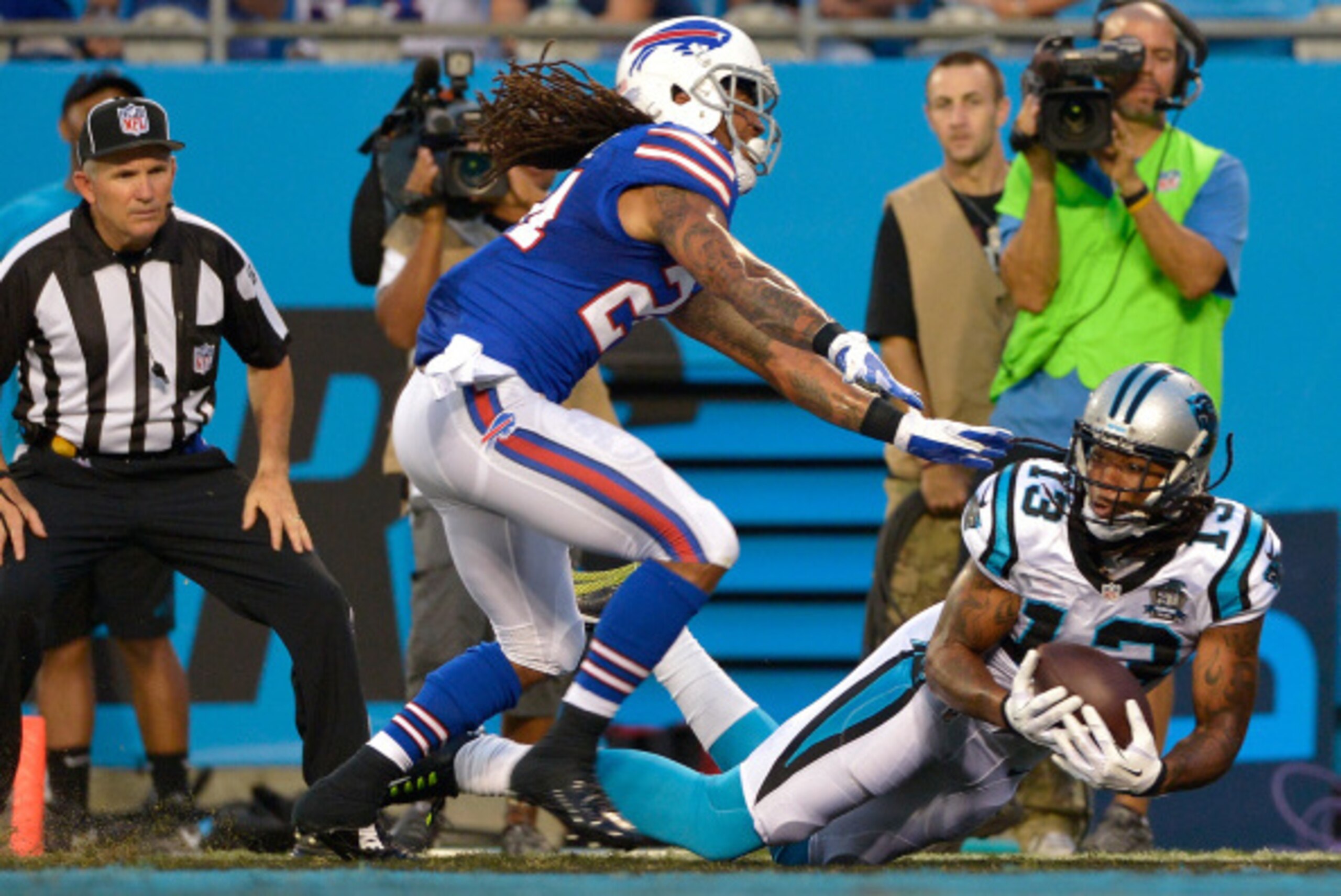 CHARLOTTE, NC - AUGUST 08:  Kelvin Benjamin #13 of the Carolina Panthers makes a touchdown catch as Stephon Gilmore #24 of the Buffalo Bills defends during their game at Bank of America Stadium on August 8, 2014 in Charlotte, North Carolina.  (Photo by Gr