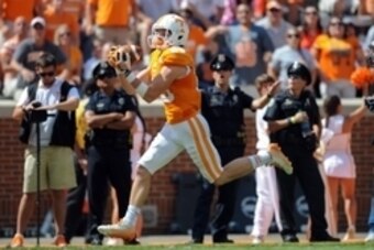 Sep 28, 2013; Knoxville, TN, USA; Tennessee Volunteers wide receiver Josh Smith (25) catches a touchdown pass against the South Alabama Jaguars during the second quarter at Neyland Stadium. Mandatory Credit: Randy Sartin-USA TODAY Sports