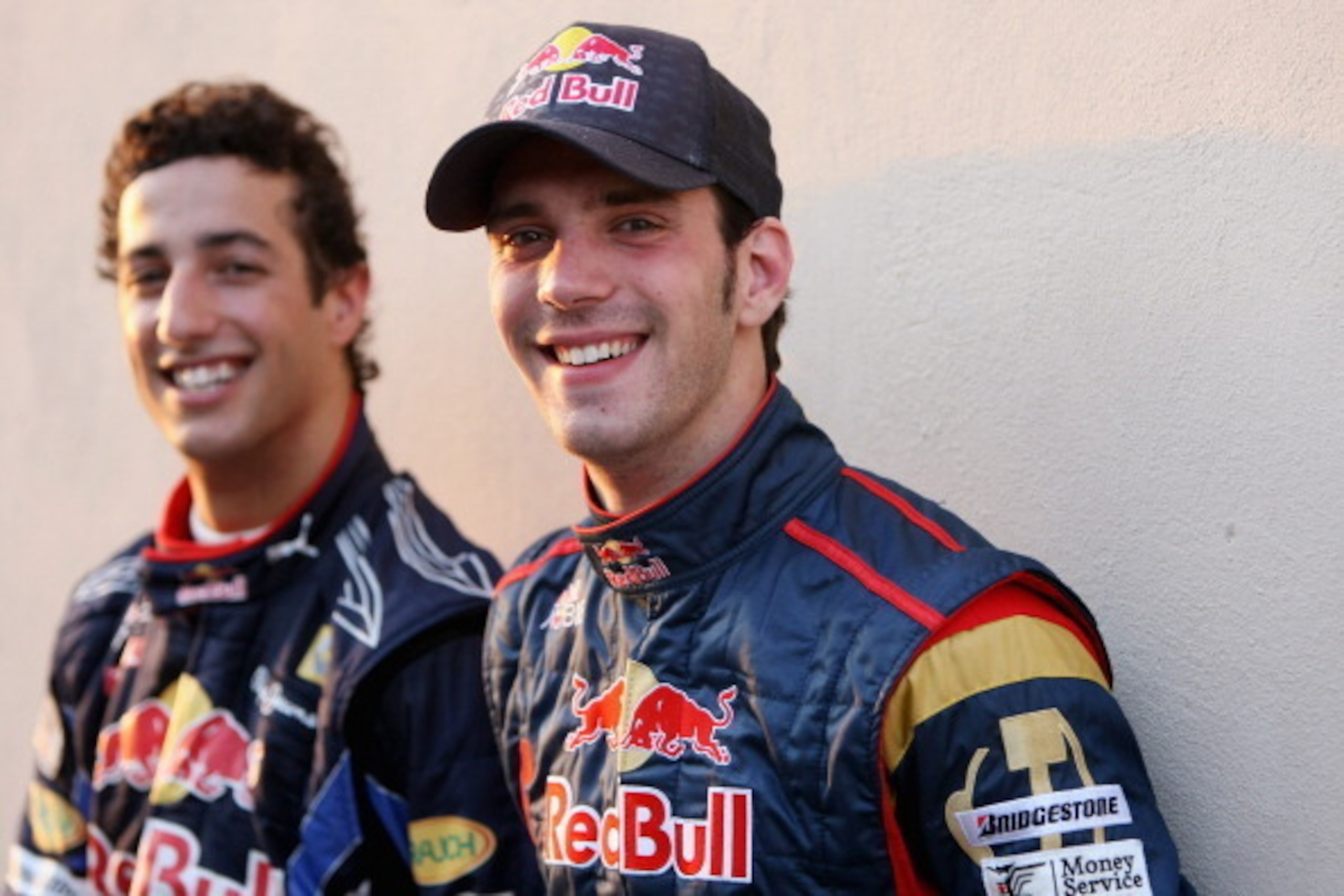 ABU DHABI, UNITED ARAB EMIRATES - NOVEMBER 16:  L-R, Daniel Ricciardo of Australia and Red Bull Racing and Jean-Eric Vergne of France and Scuderia Toro Rosso pose for a picture during the Young Driver Testing at the Yas Marina Circuit on November 16, 2010