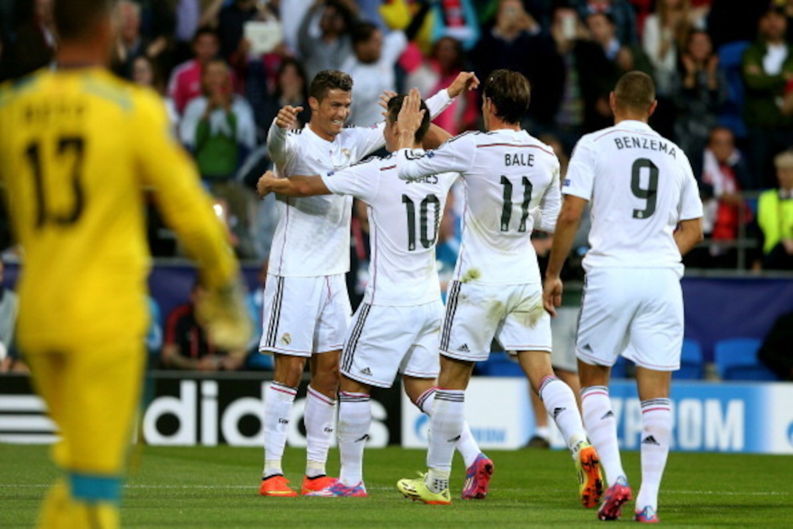 CARDIFF, WALES - AUGUST 12:  (L-R) Cristiano Ronaldo of Real Madrid celebrates with teammates James Rodriguez, Gareth Bale and Karim Benzema after scoring the opening goal during the UEFA Super Cup between Real Madrid and Sevilla FC at Cardiff City Stadiu
