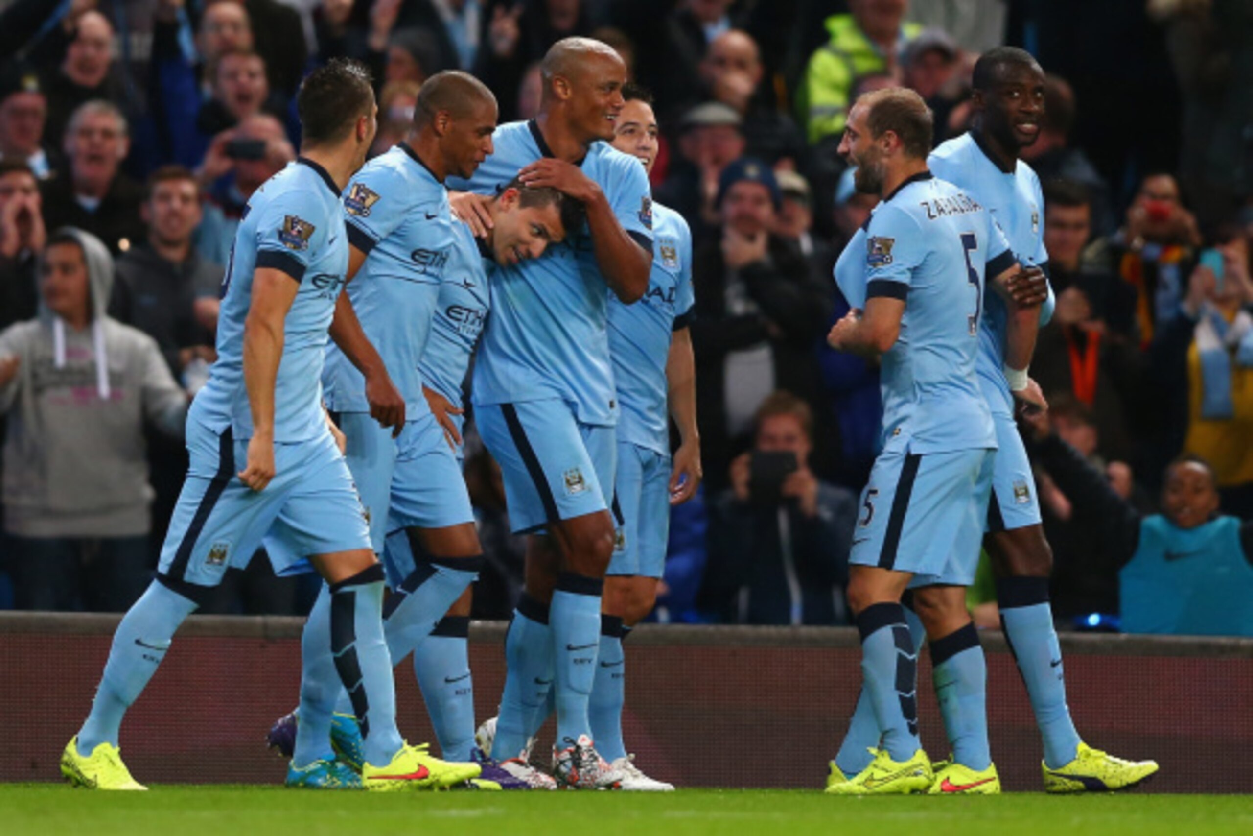 MANCHESTER, ENGLAND - AUGUST 25:  Sergio Aguero of Manchester City celebrates scoring the third goal with his team-mates during the Barclays Premier League match between Manchester City and Liverpool at the Etihad Stadium on August 25, 2014 in Manchester,