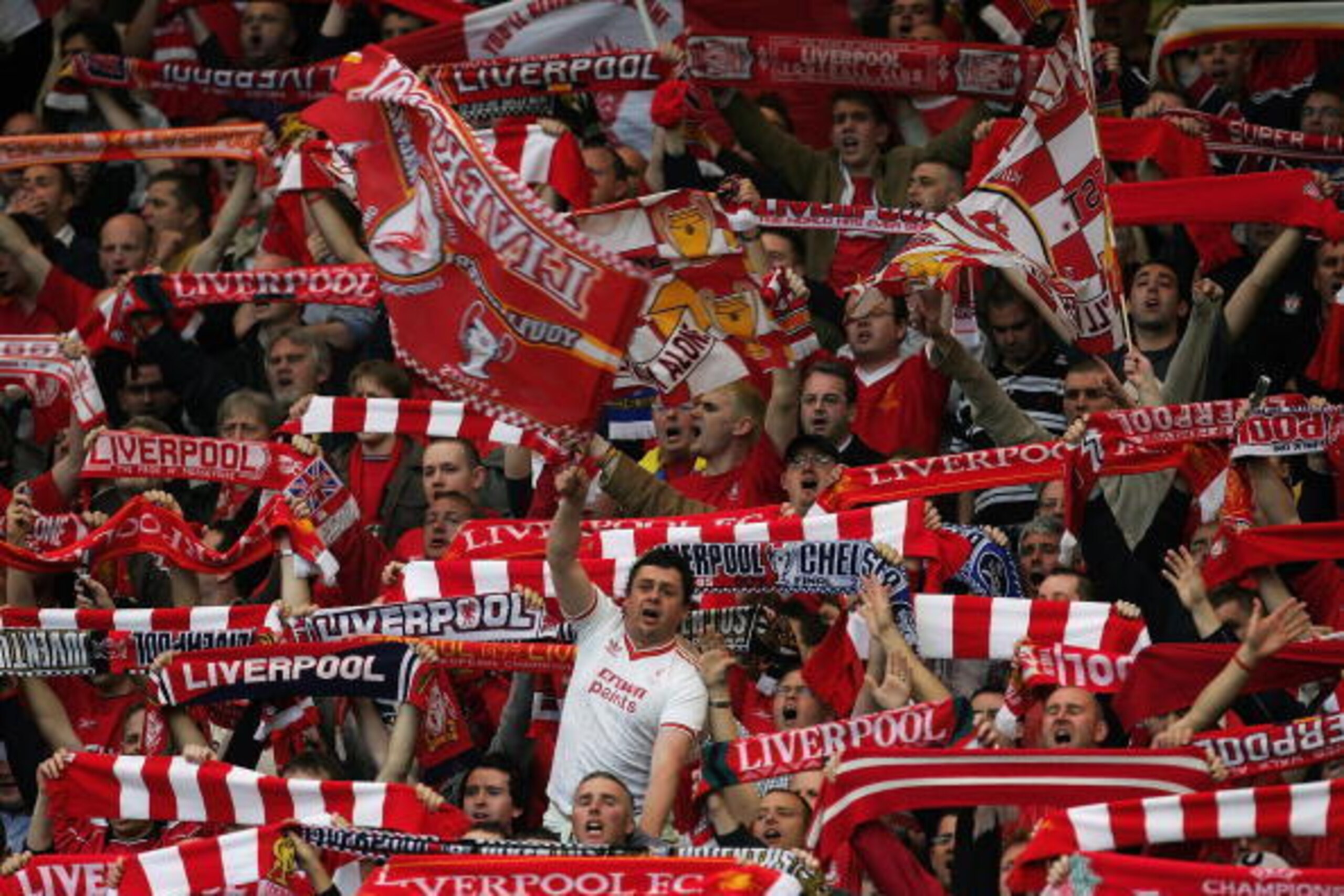 LIVERPOOL, ENGLAND - MAY 3: Liverpool fans wave flags and scarves in the Kop before the UEFA Champions League semi-final second leg match between Liverpool and Chelsea at Anfield on May 3, 2005 in Liverpool, England.  (Photo by Laurence Griffiths/Getty Im