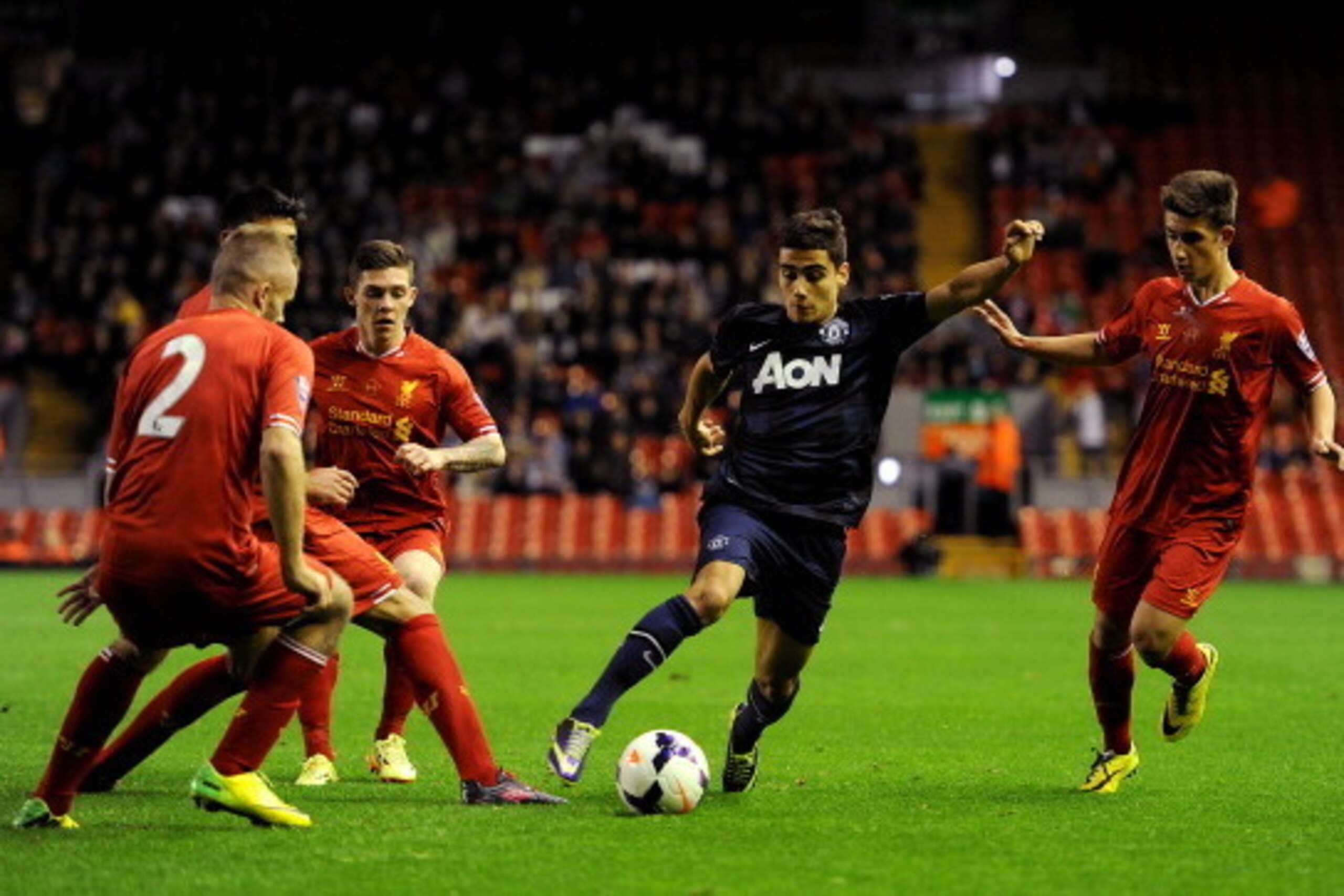 LIVERPOOL, ENGLAND - MAY 02: Andreas Pereira of Manchester United runs at the Liverpool defence during the Barclays U21 Premier League Semi Final match between Liverpool and Manchester United at Anfield on May 02, 2014 in Liverpool, England. (Photo by Chr
