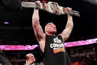 Lesnar with the new WWE World Heavyweight Championship.