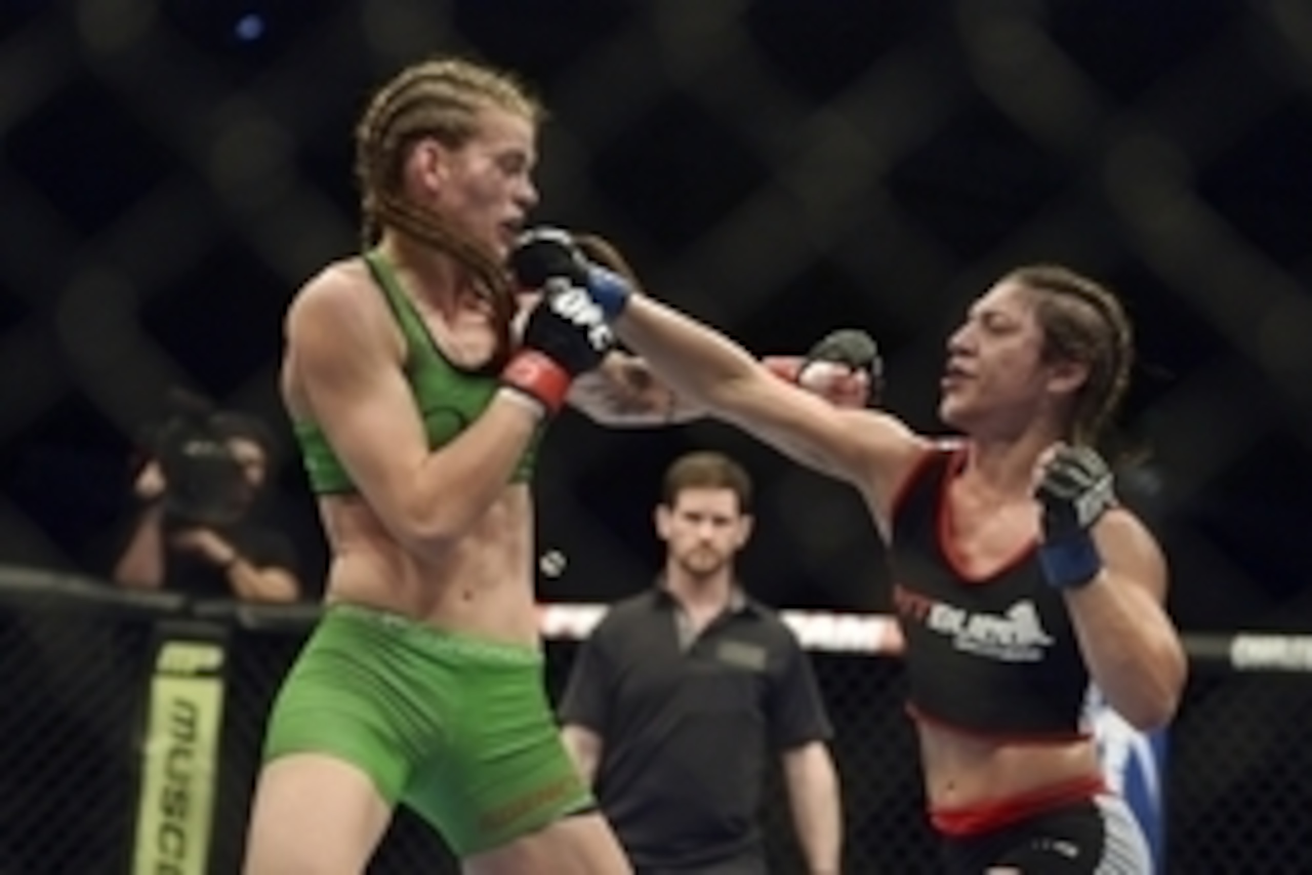 Apr 26, 2014; Baltimore, MD, USA;  Bethe Correia (right) lands a head shot on Jessamyn Duke during the second round  in UFC 172 at Baltimore Arena. Correia defeated Duke by judges decision.  Mandatory Credit: Tommy Gilligan-USA TODAY Sports