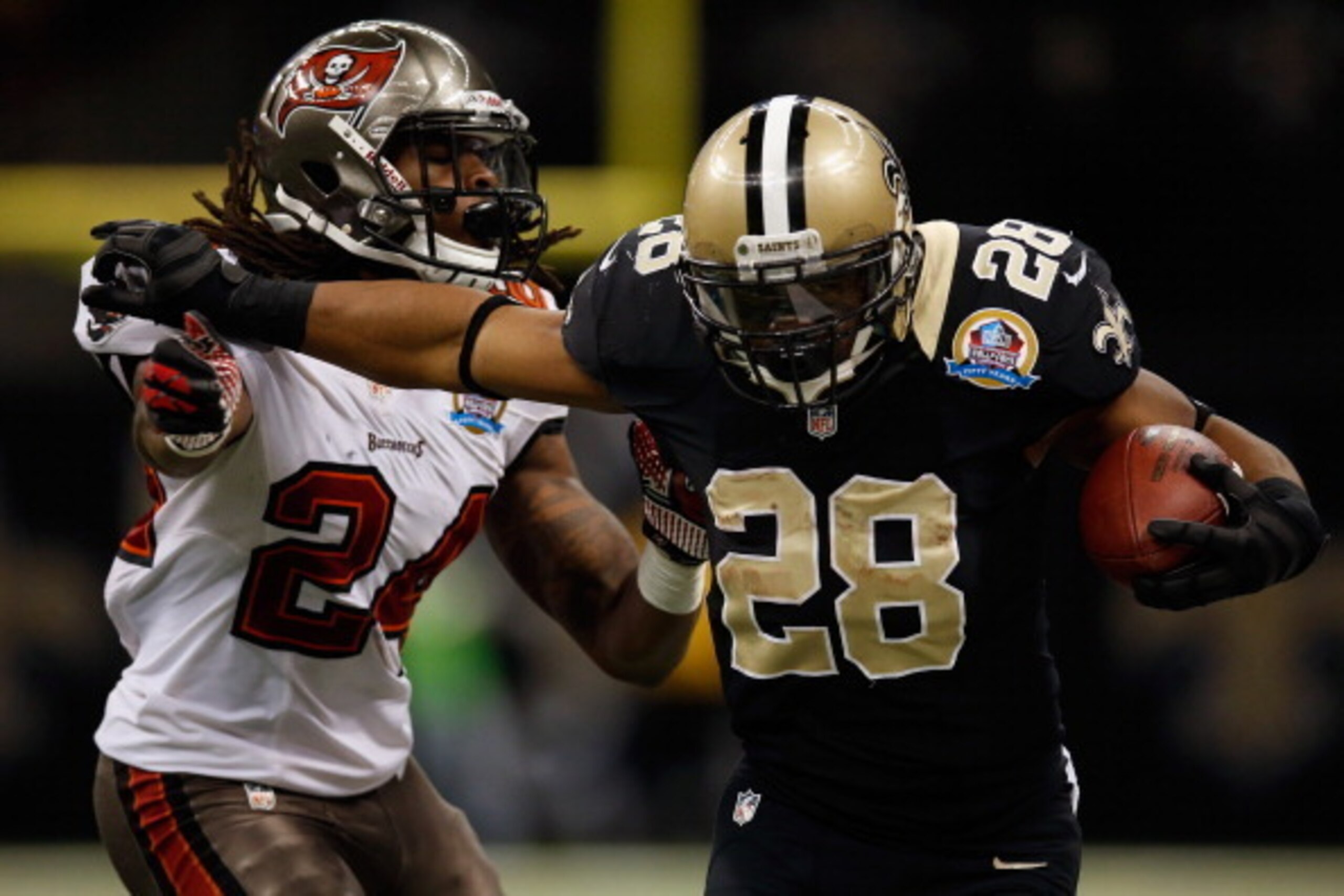 NEW ORLEANS, LA - DECEMBER 16:  Mark Ingram #28 of the New Orleans Saints is pushed out of bounds by  Mark Barron #24 of the Tampa Bay Buccaneers at the Mercedes-Benz Superdome on December 16, 2012 in New Orleans, Louisiana.  The Saints defeated the Buccs