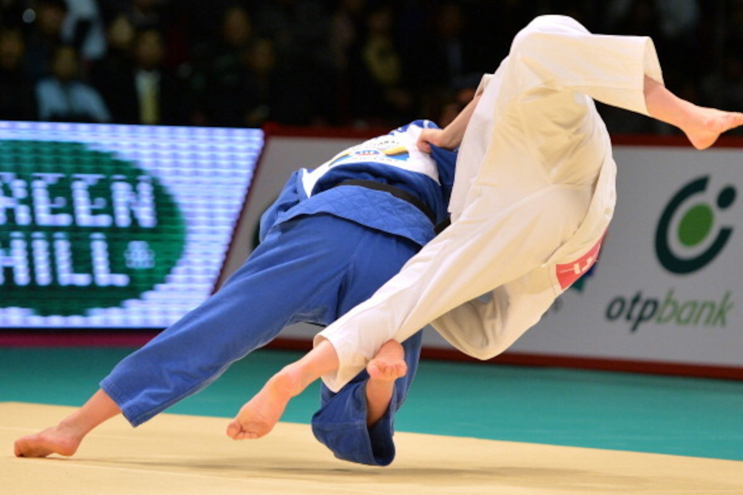 TOKYO, JAPAN - NOVEMBER 29:  Marti Malloy (white) of USA and Nae Udaka of Japan compete in the women's -57kg final match during day one of the Judo Grand Slam at the Tokyo Metropolitan Gymnasium on November 29, 2013 in Tokyo, Japan.  (Photo by Atsushi Tom