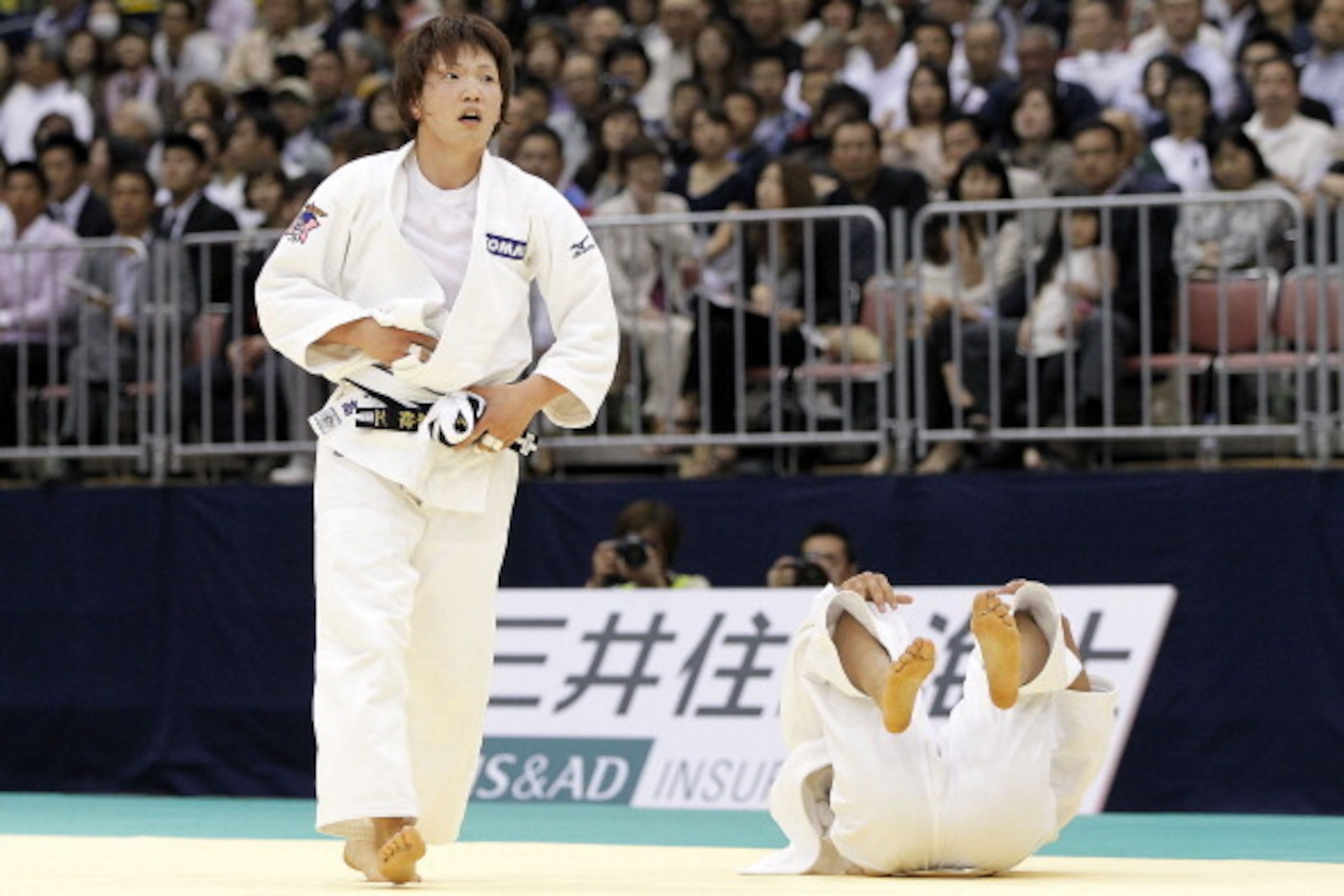 FUKUOKA, JAPAN - MAY 13:  Nae Udaka (L) reacts after throwing Kaori Matsumoto to win the Women's 57kg final during day two of the All Japan Judo Weight Class Championships 2012 at Fukuoka Kokusai Center on May 13, 2012 in Fukuoka, Japan.  (Photo by Kiyosh