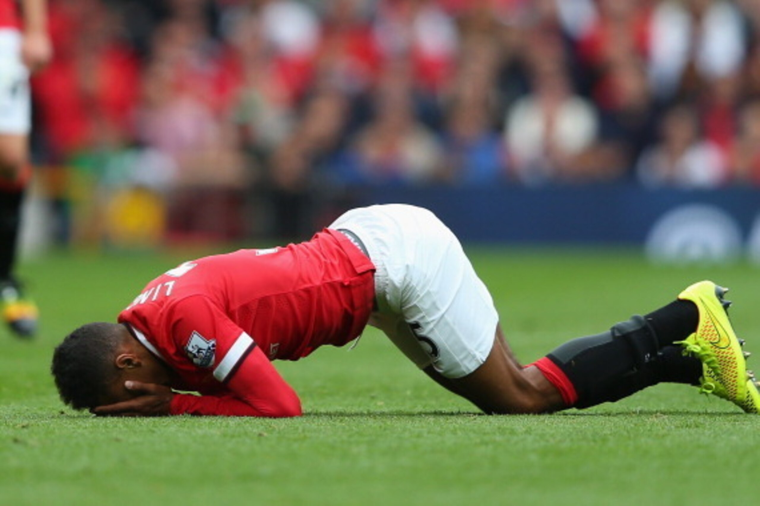 MANCHESTER, ENGLAND - AUGUST 16:  Jesse Lingard of Manchester United reacts to an injury during the Barclays Premier League match between Manchester United and Swansea City at Old Trafford on August 16, 2014 in Manchester, England.  (Photo by Alex Livesey