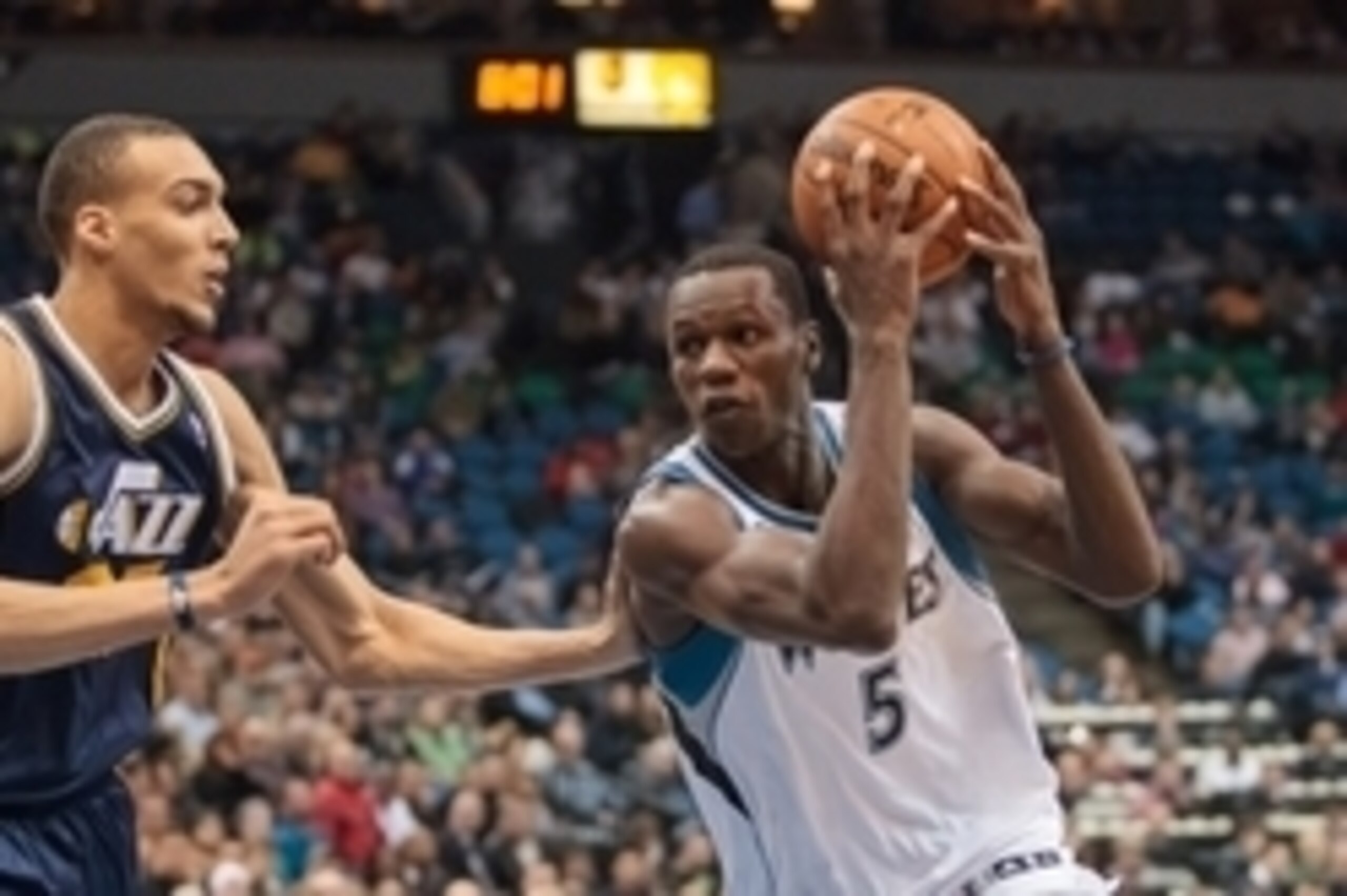 Apr 16, 2014; Minneapolis, MN, USA; Minnesota Timberwolves center Gorgui Dieng (5) drives in the second quarter against the Utah Jazz center Rudy Gobert (27) at Target Center. Mandatory Credit: Brad Rempel-USA TODAY Sports