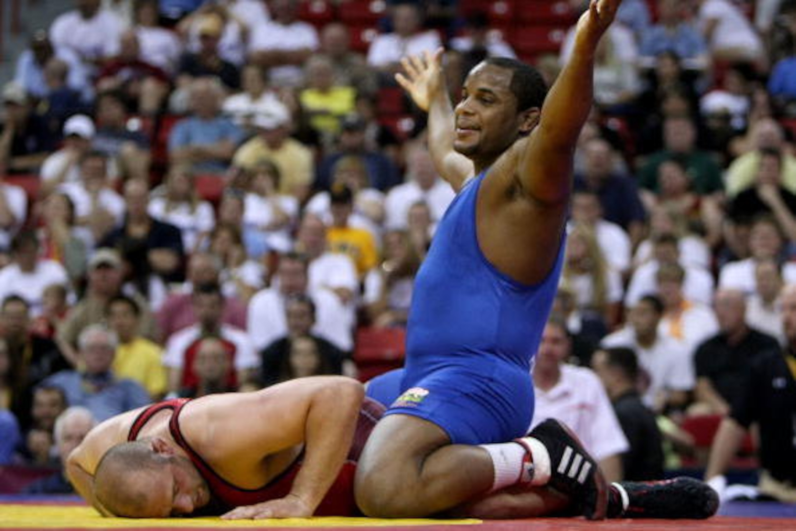 LAS VEGAS - JUNE 15:  Daniel Cormier (blue) celebrates his win over Damion Hahn (red) in the Freestyle 96kg division championship match during the USA Olympic trials for wrestling and judo on June 15, 2008 at the Thomas & Mack Center in Las Vegas, Neveda.