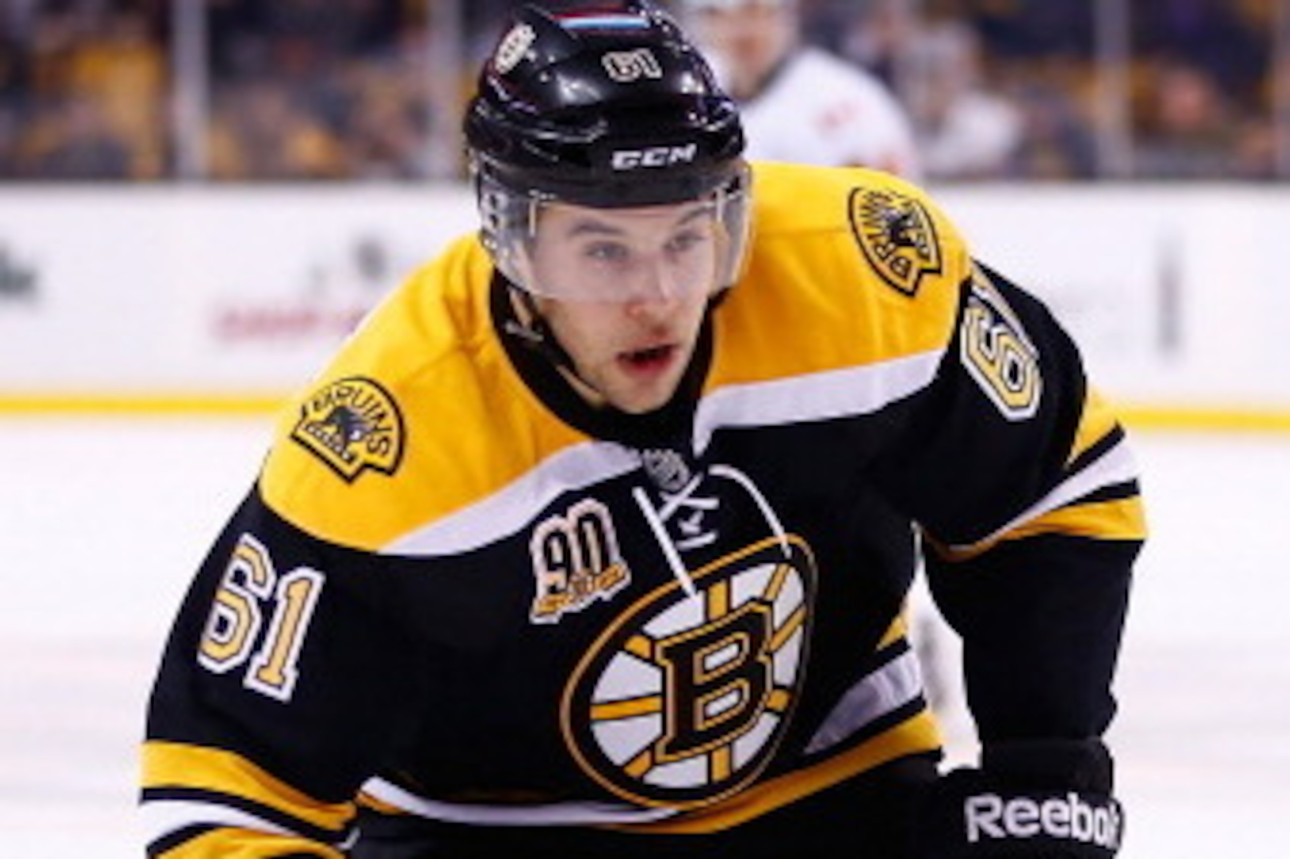 BOSTON, MA - DECEMBER 17:  Craig Cunningham #61 of the Boston Bruins skates against the Calgary Flames during the game at TD Garden on December 17, 2013 in Boston, Massachusetts.  (Photo by Jared Wickerham/Getty Images)